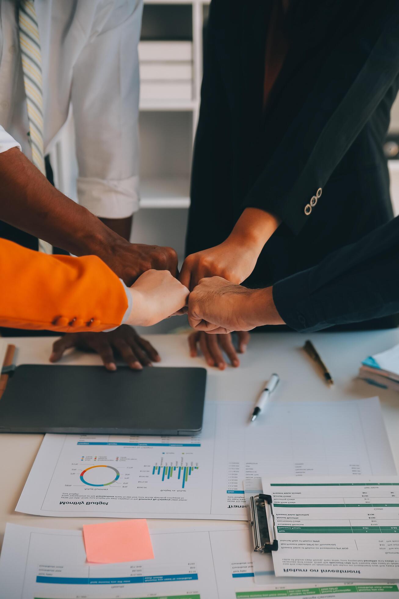 Large business team showing unity with their hands together Stock Free