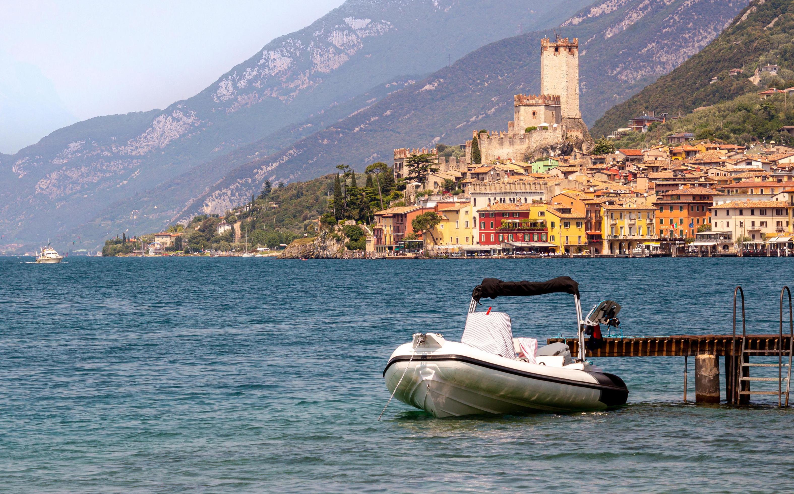 View from lakeside walkway to famous mediterrean town Malcesine, Lago di Garda Garda lake, Italy Stock Free