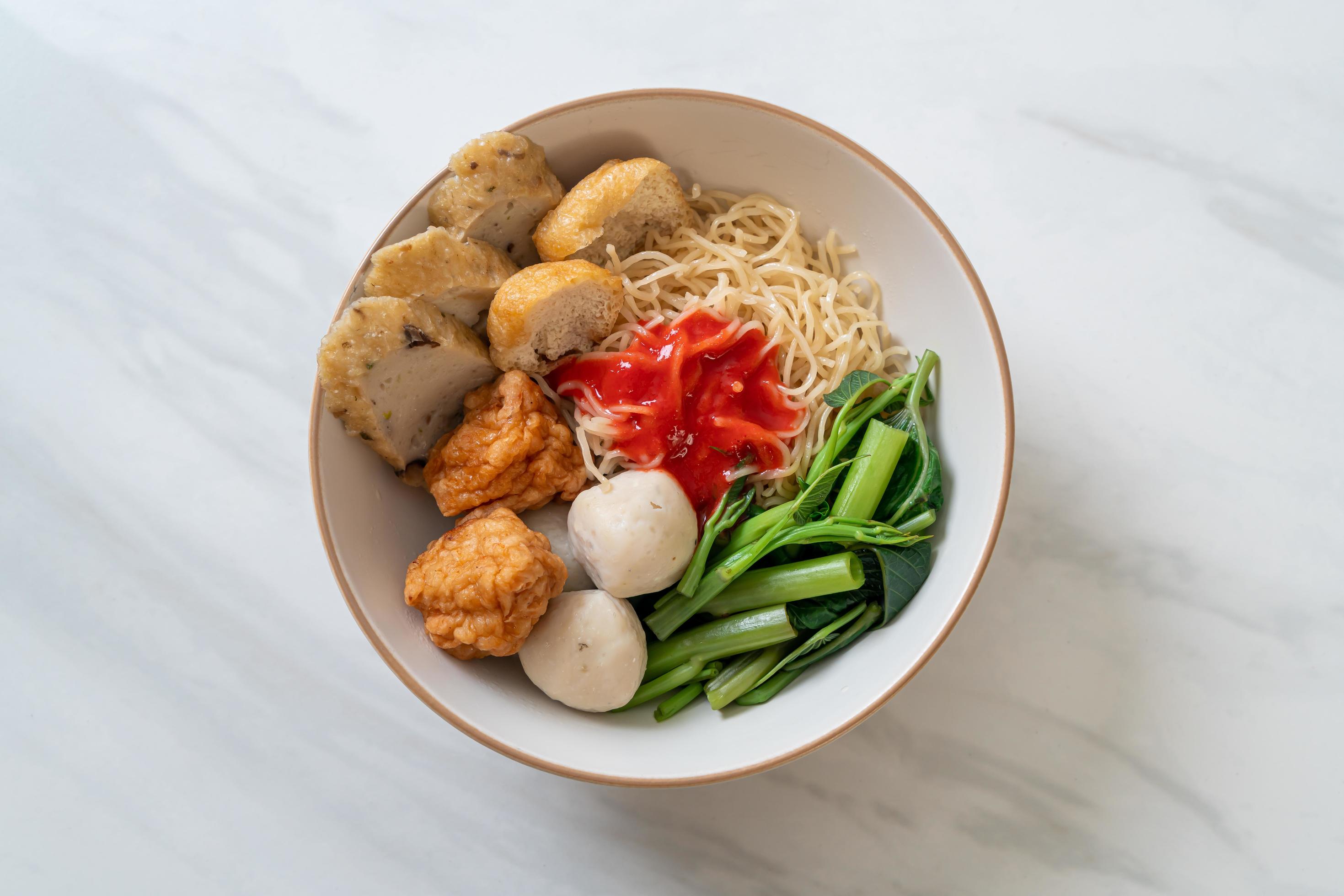 Egg noodles with fish balls and shrimp balls in pink sauce, Yen Ta Four or Yen Ta Fo – Asian food style Stock Free