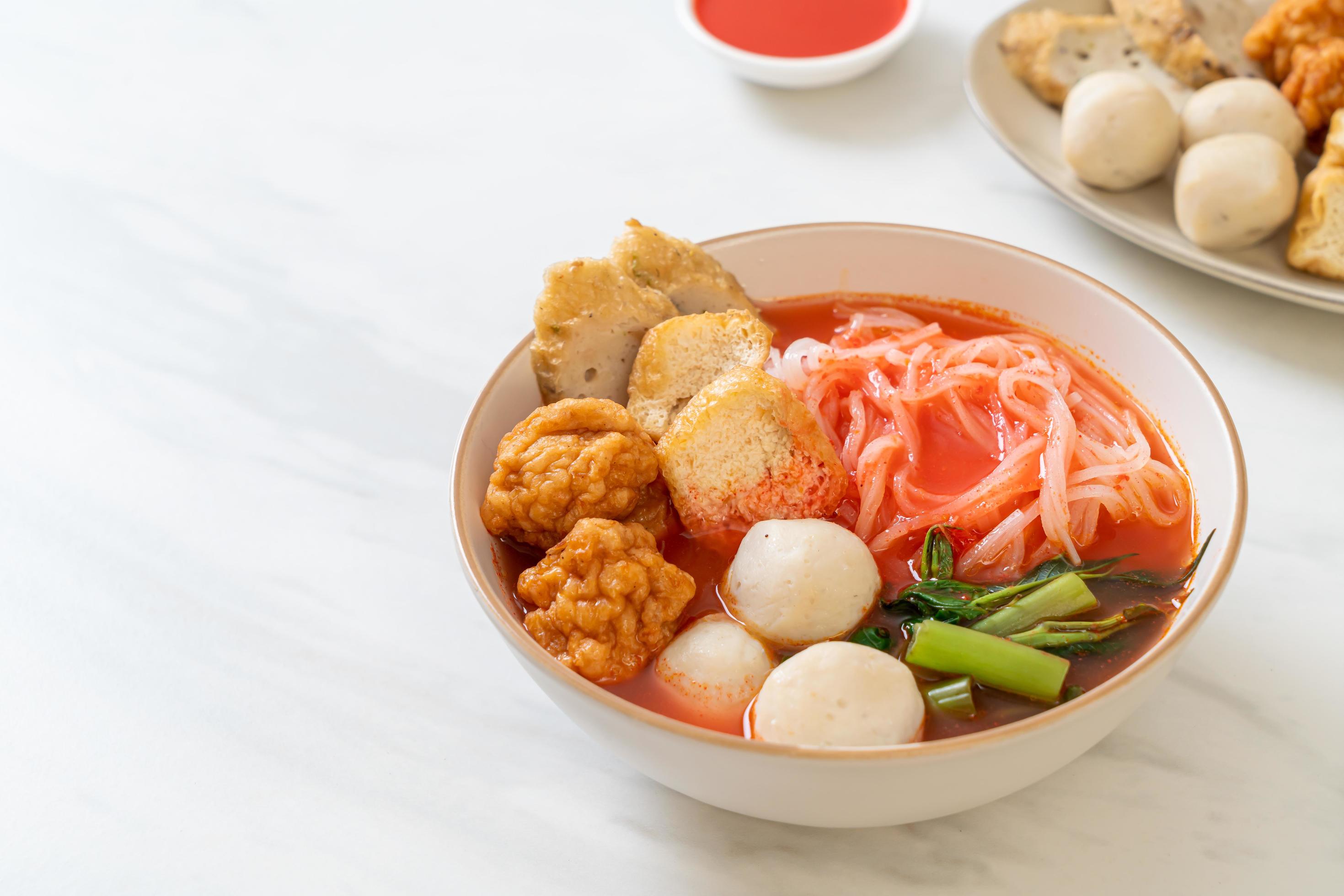 Small flat rice noodles with fish balls and shrimp balls in pink soup, Yen Ta Four or Yen Ta Fo – Asian food style Stock Free