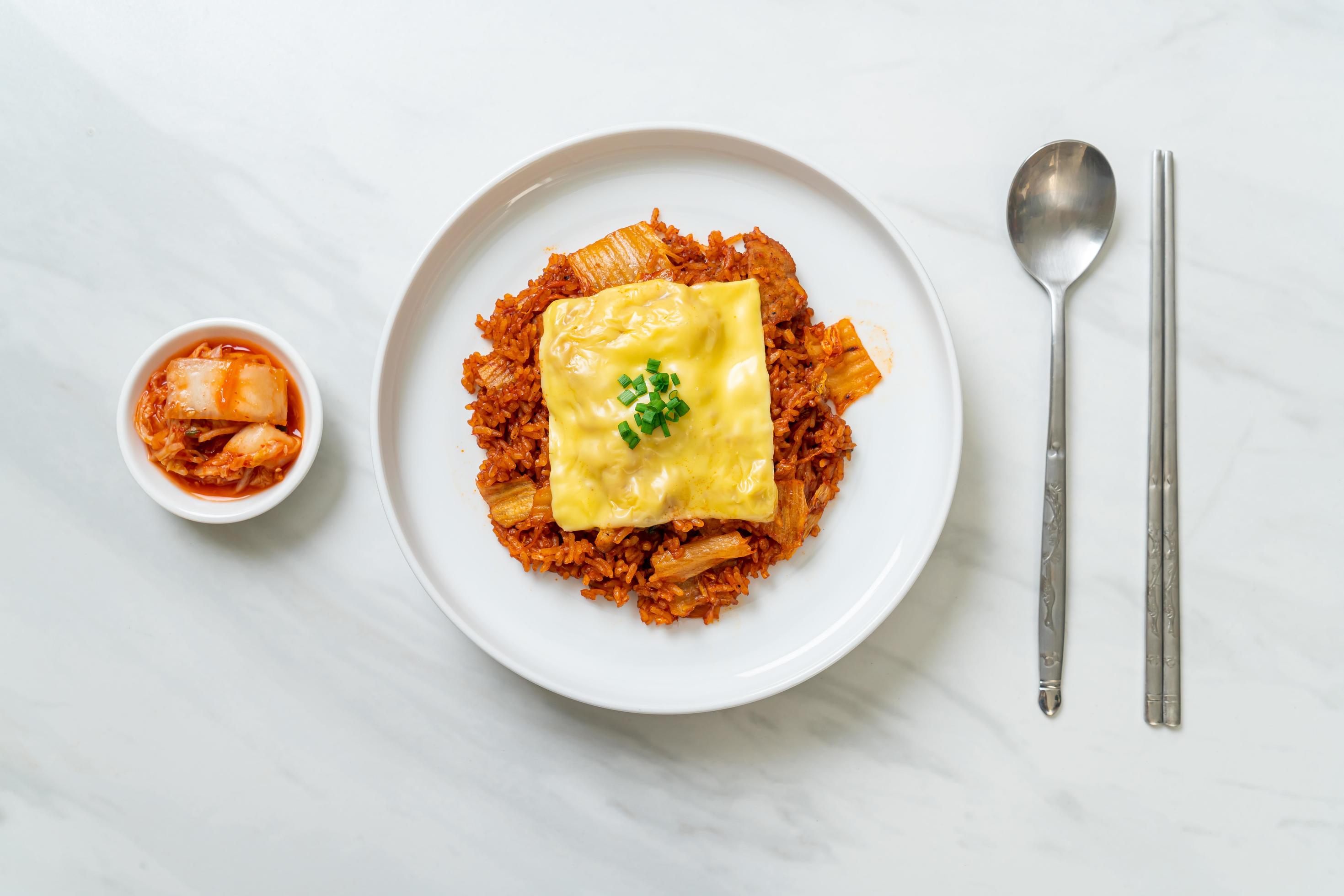 Kimchi fried rice with pork and topped cheese – Asian and fusion food style Stock Free