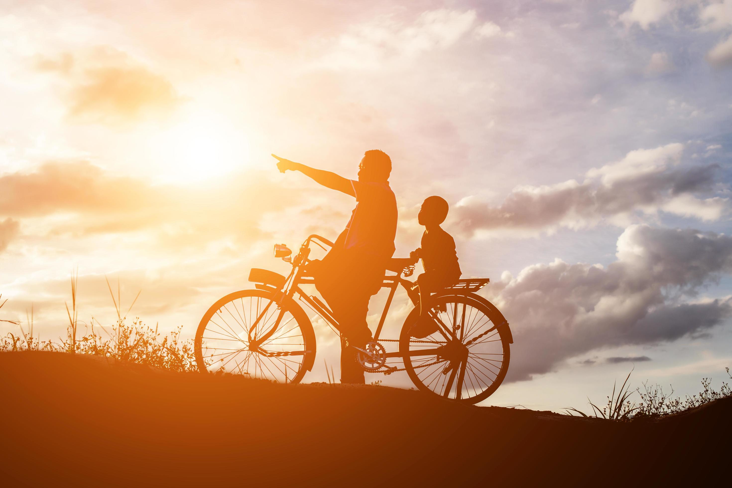 Biker family silhouette father and son Stock Free