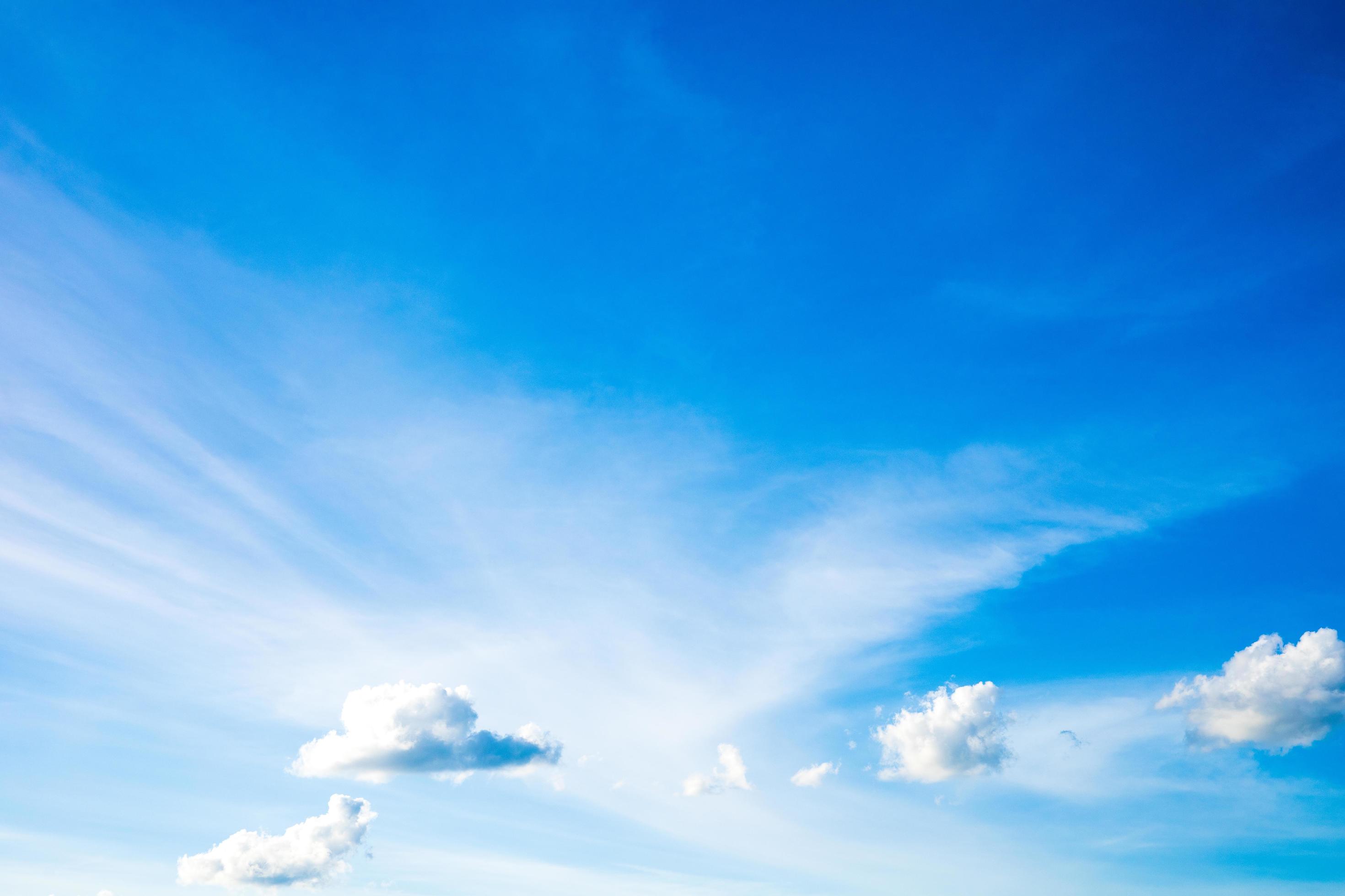 Beautiful bright blue sky with white clouds, nature background concept. Stock Free