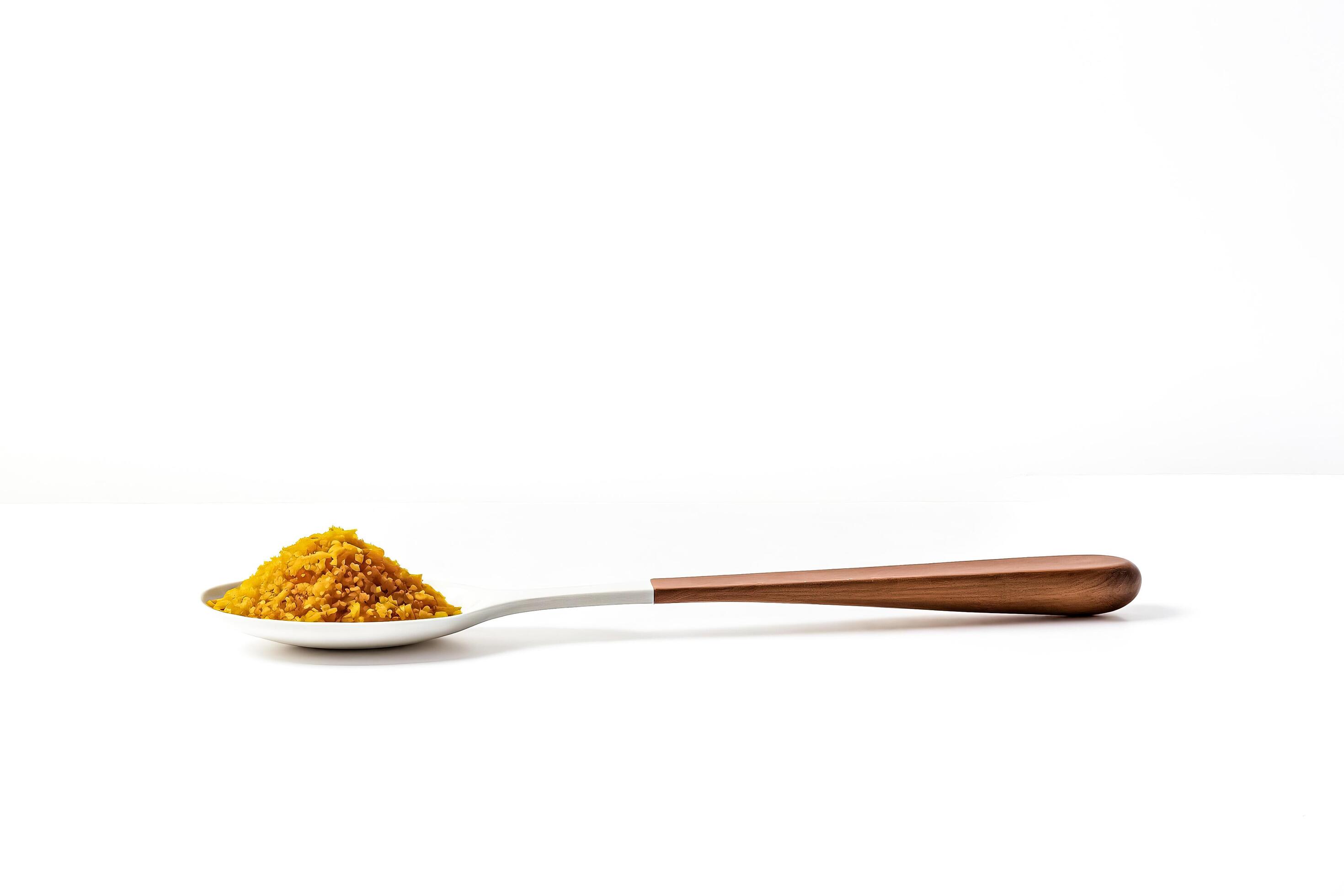 Spoon with Turmeric Powder on White Background Stock Free