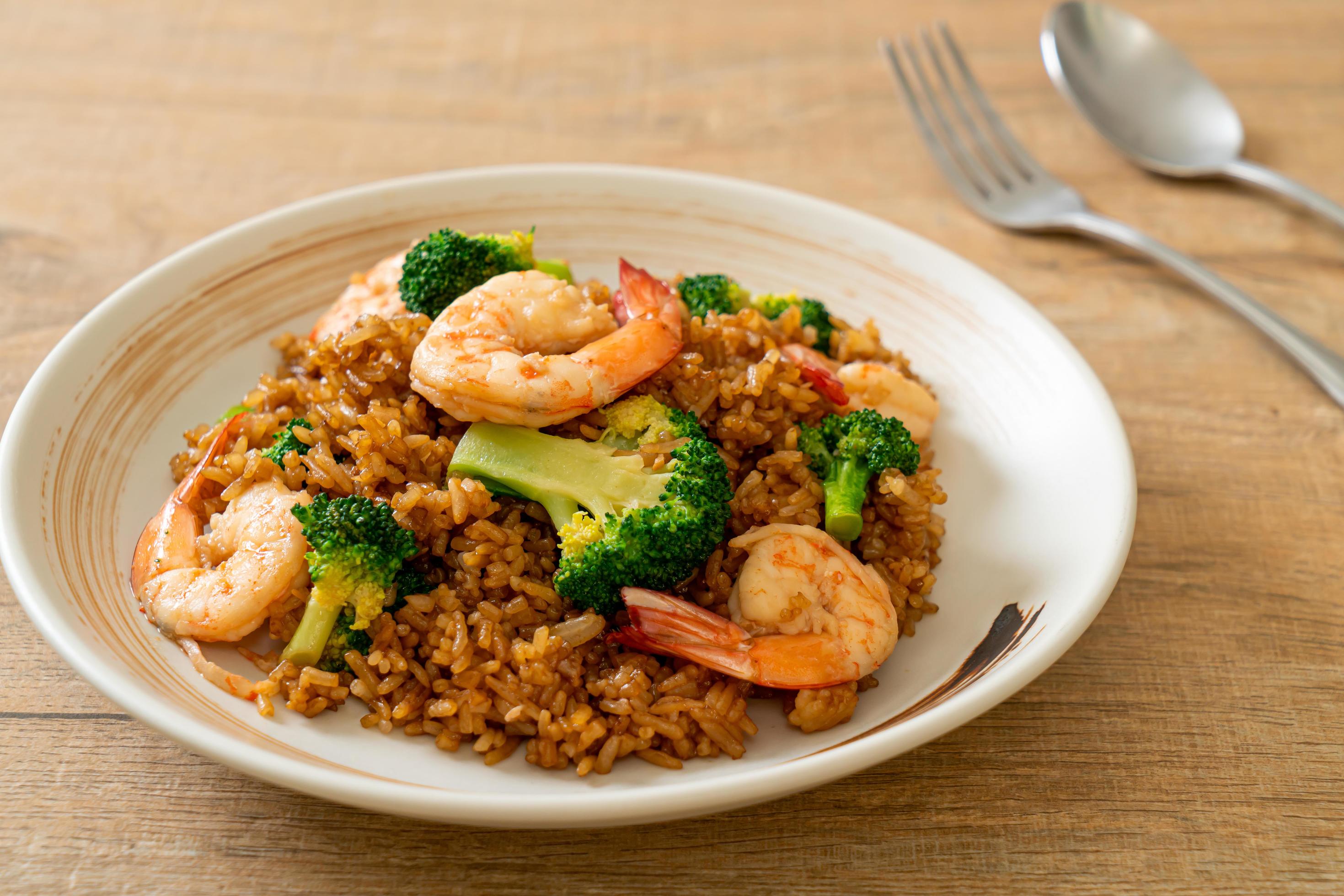 Fried rice with broccoli and shrimps – homemade food style Stock Free