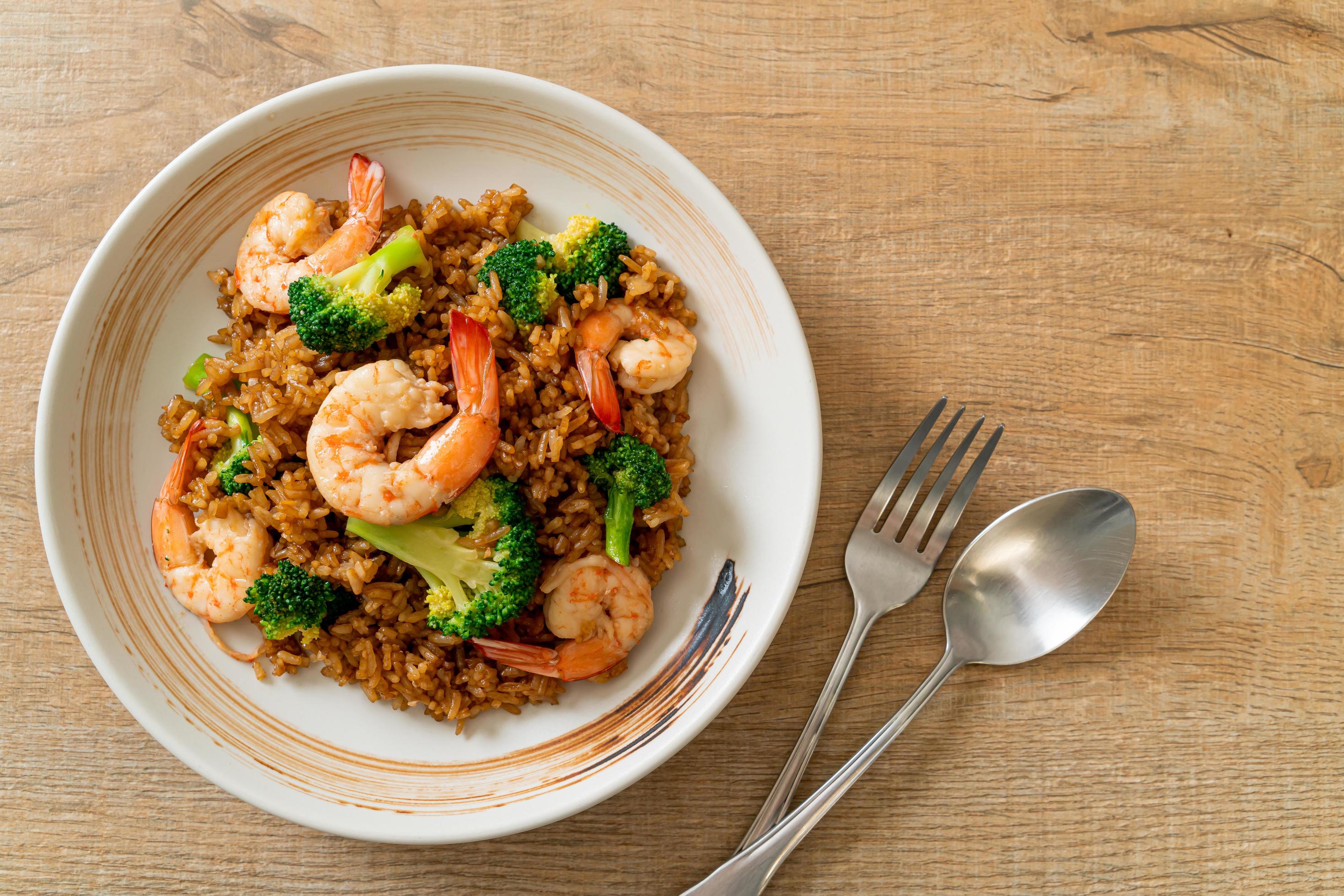 Fried rice with broccoli and shrimps – homemade food style Stock Free