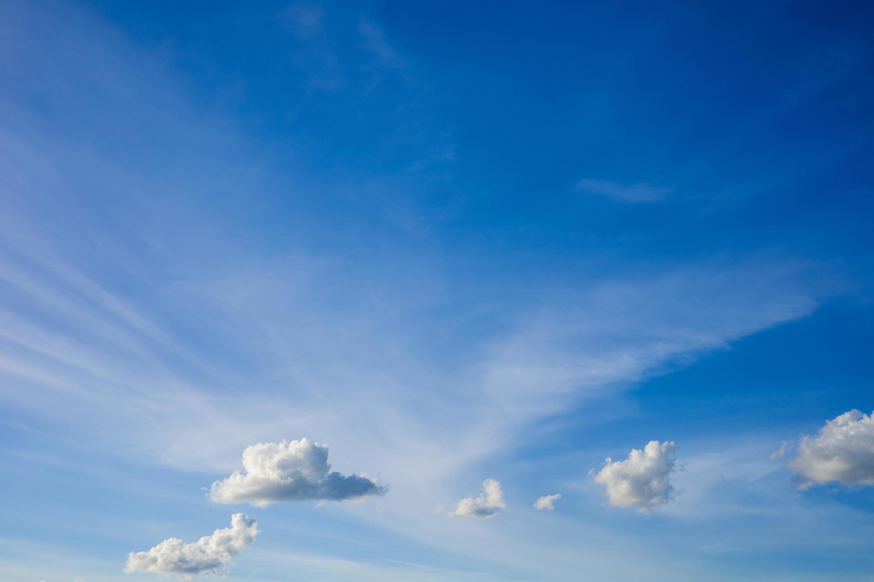 Beautiful bright blue sky with white clouds, nature background concept. Stock Free