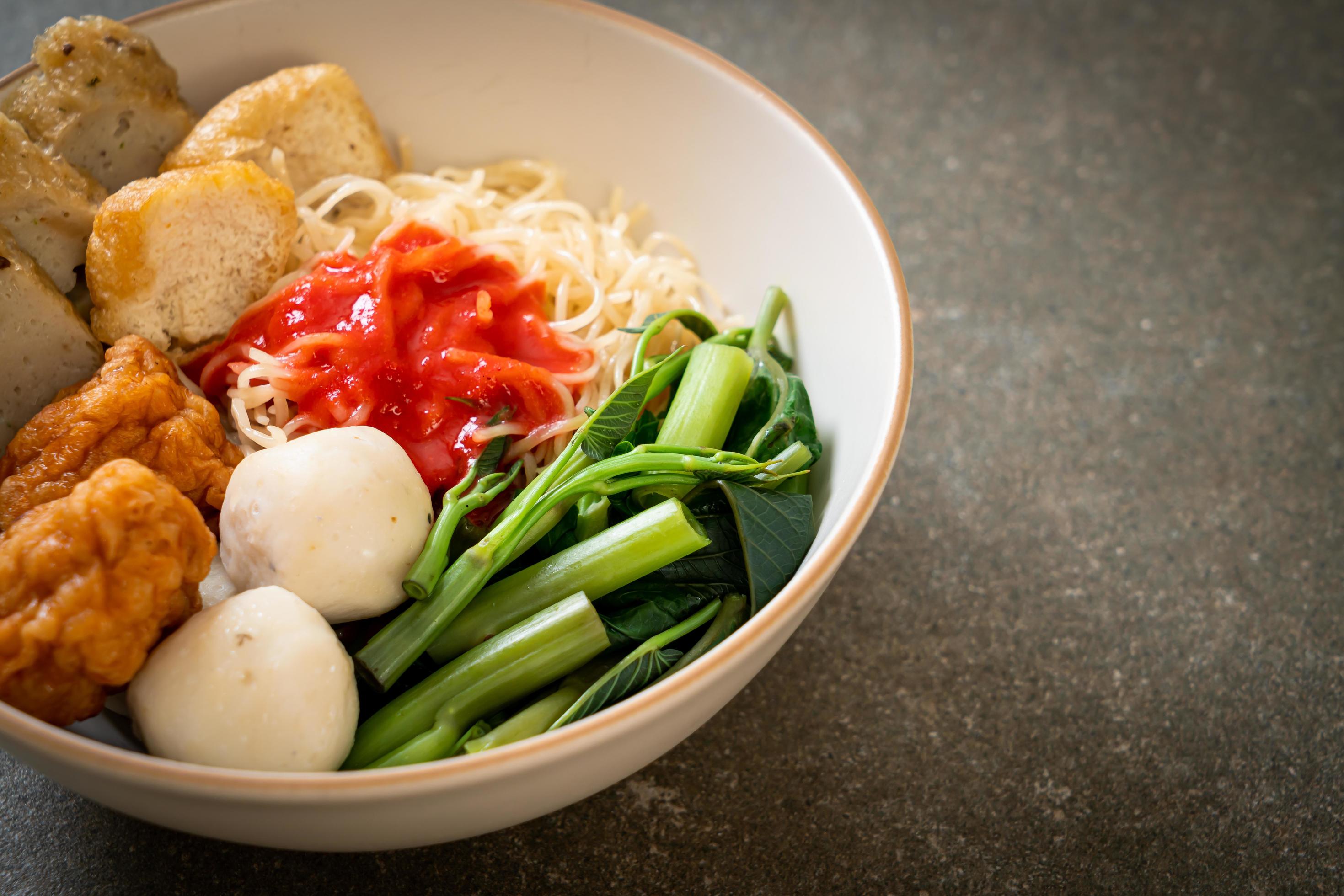 Egg noodles with fish balls and shrimp balls in pink sauce, Yen Ta Four or Yen Ta Fo – Asian food style Stock Free