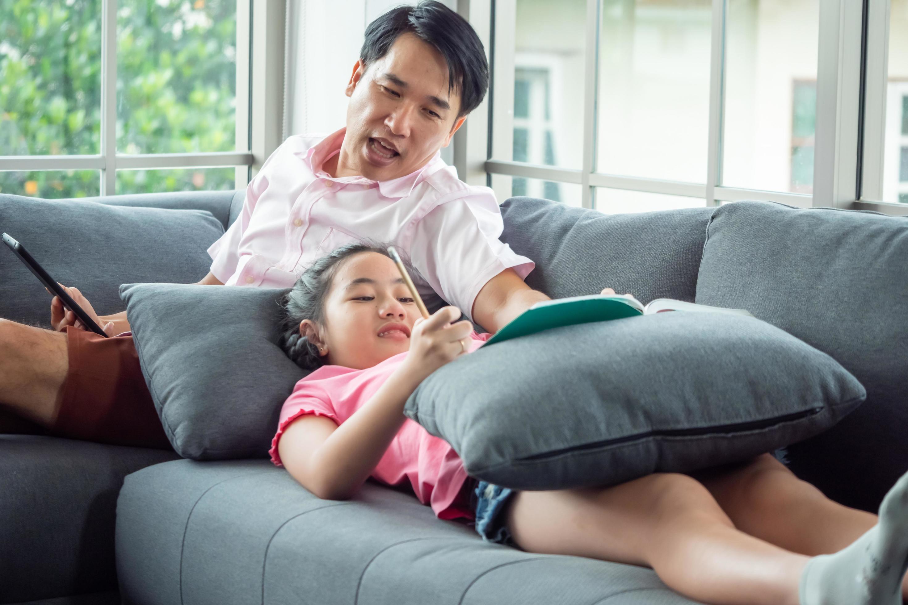 
									Happy family with father and daughter spending time together at home. Stock Free