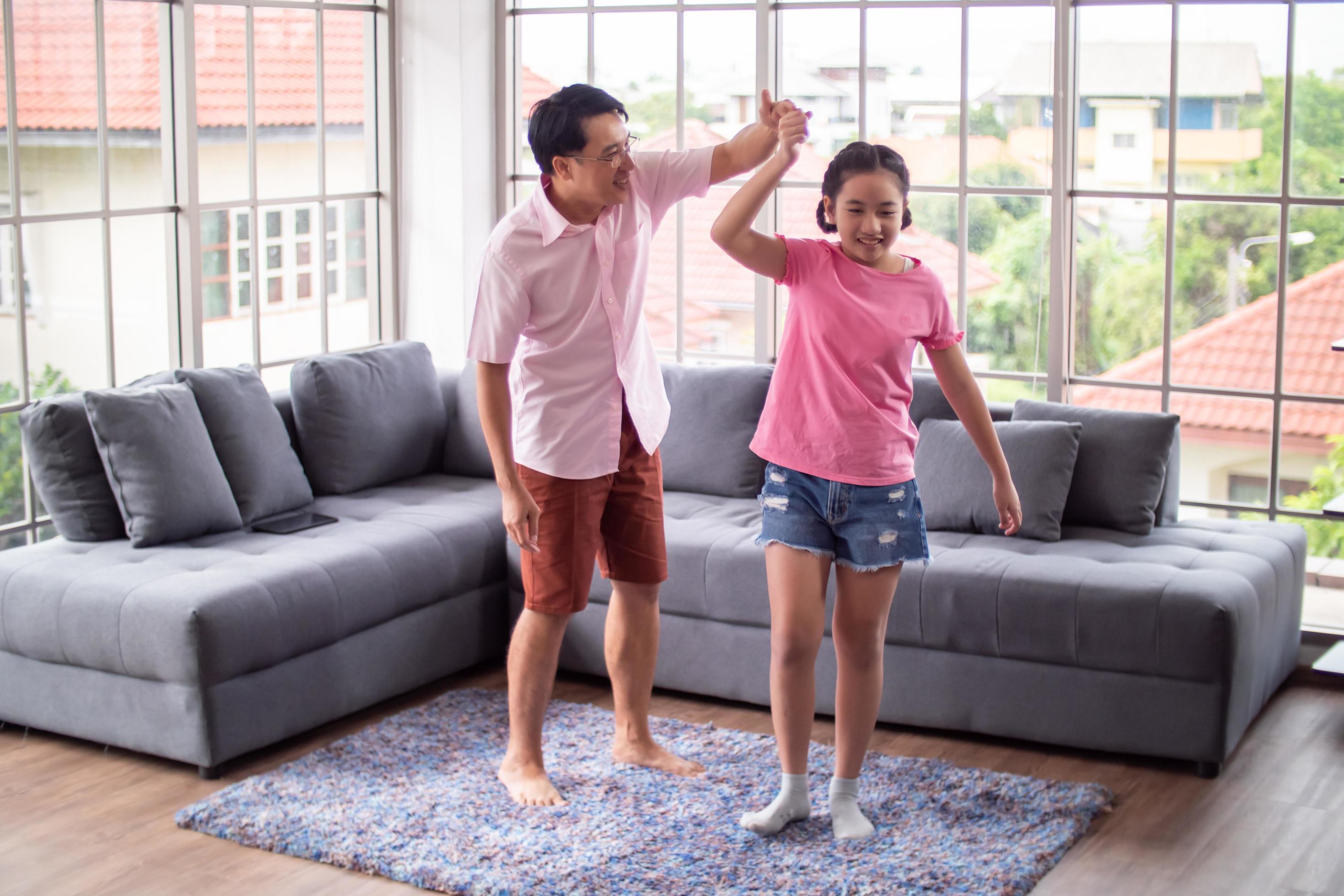 Happy family with father and daughter spending time together at home. Stock Free