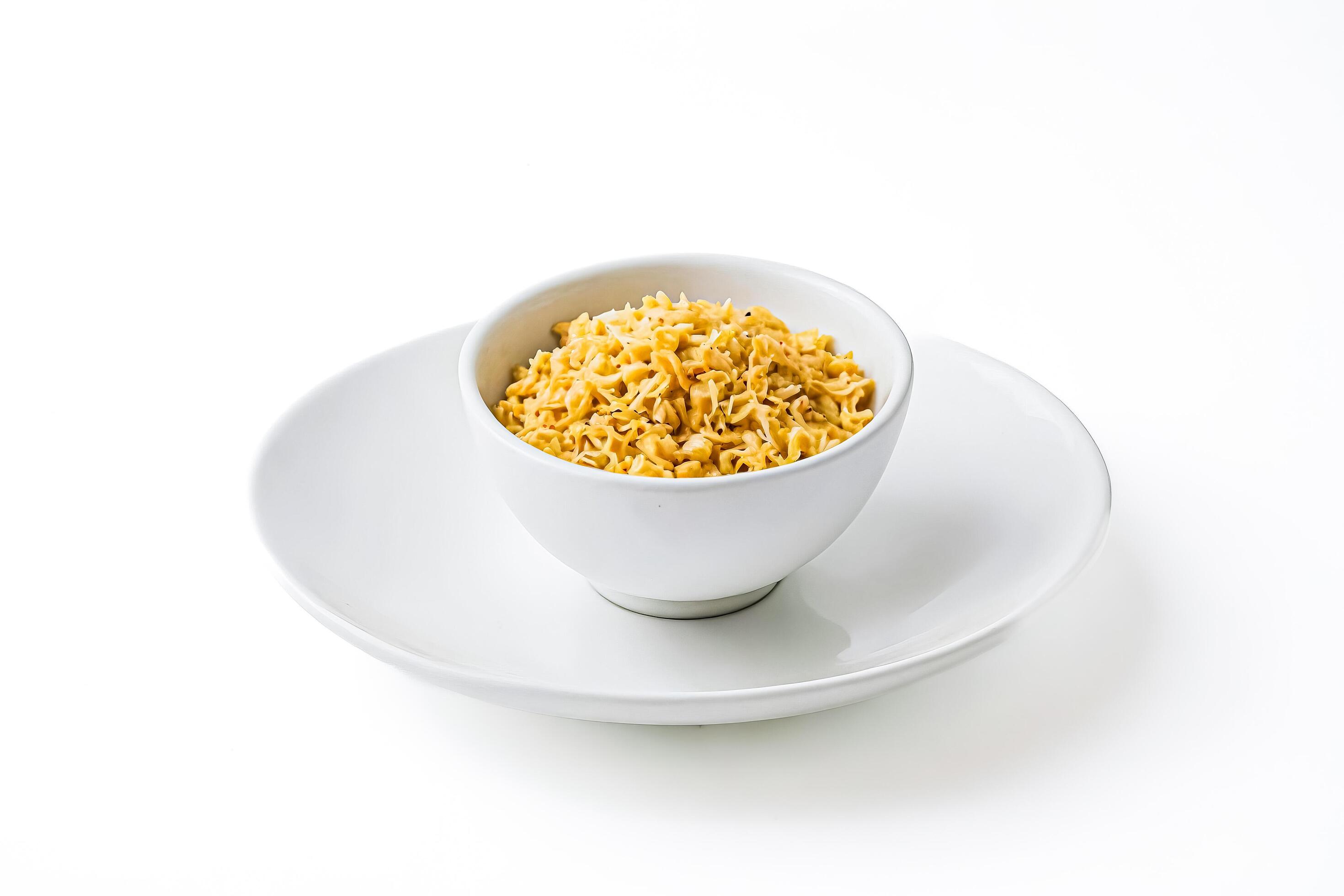 Bowl of cooked pasta on white background Stock Free