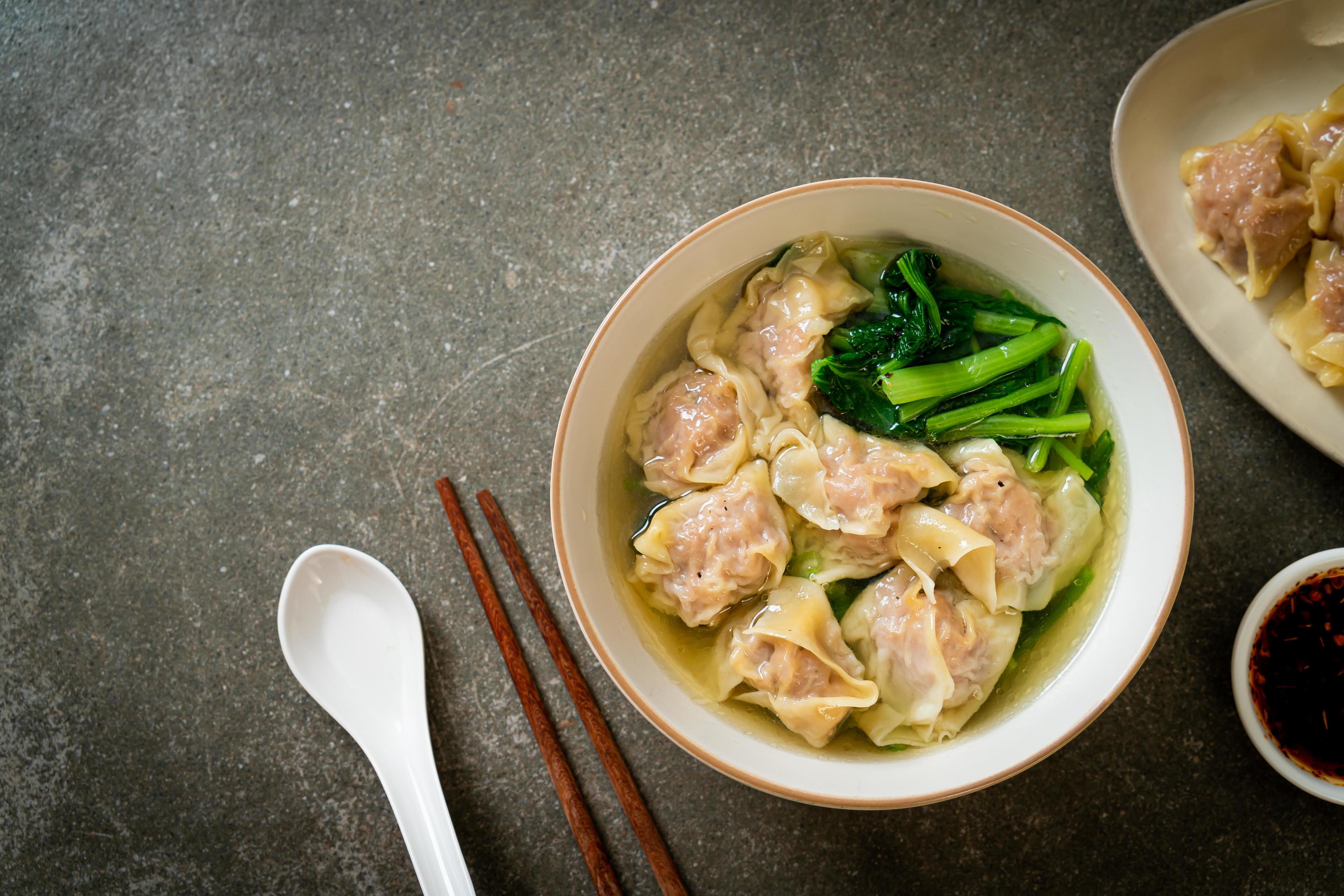 Pork wonton soup or pork dumplings soup with vegetable – Asian food style Stock Free