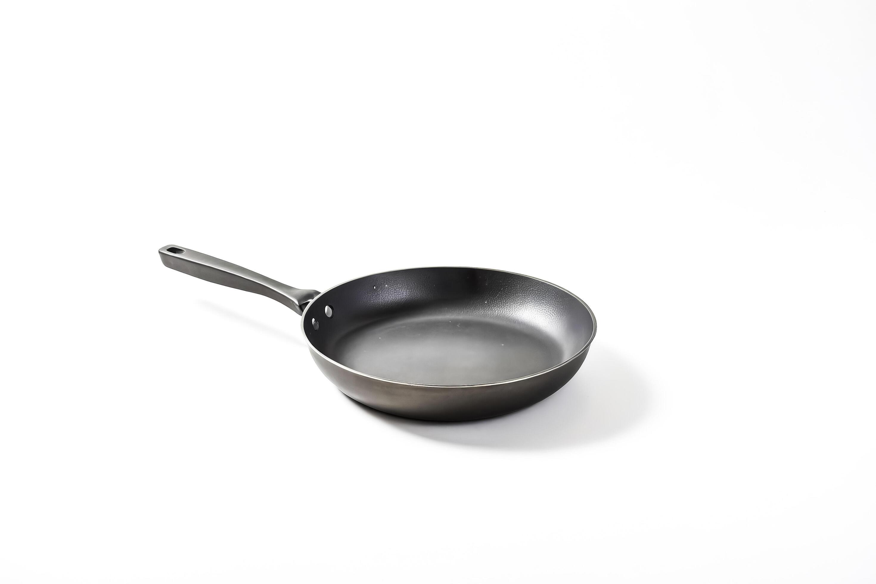 Black frying pan on white background Stock Free