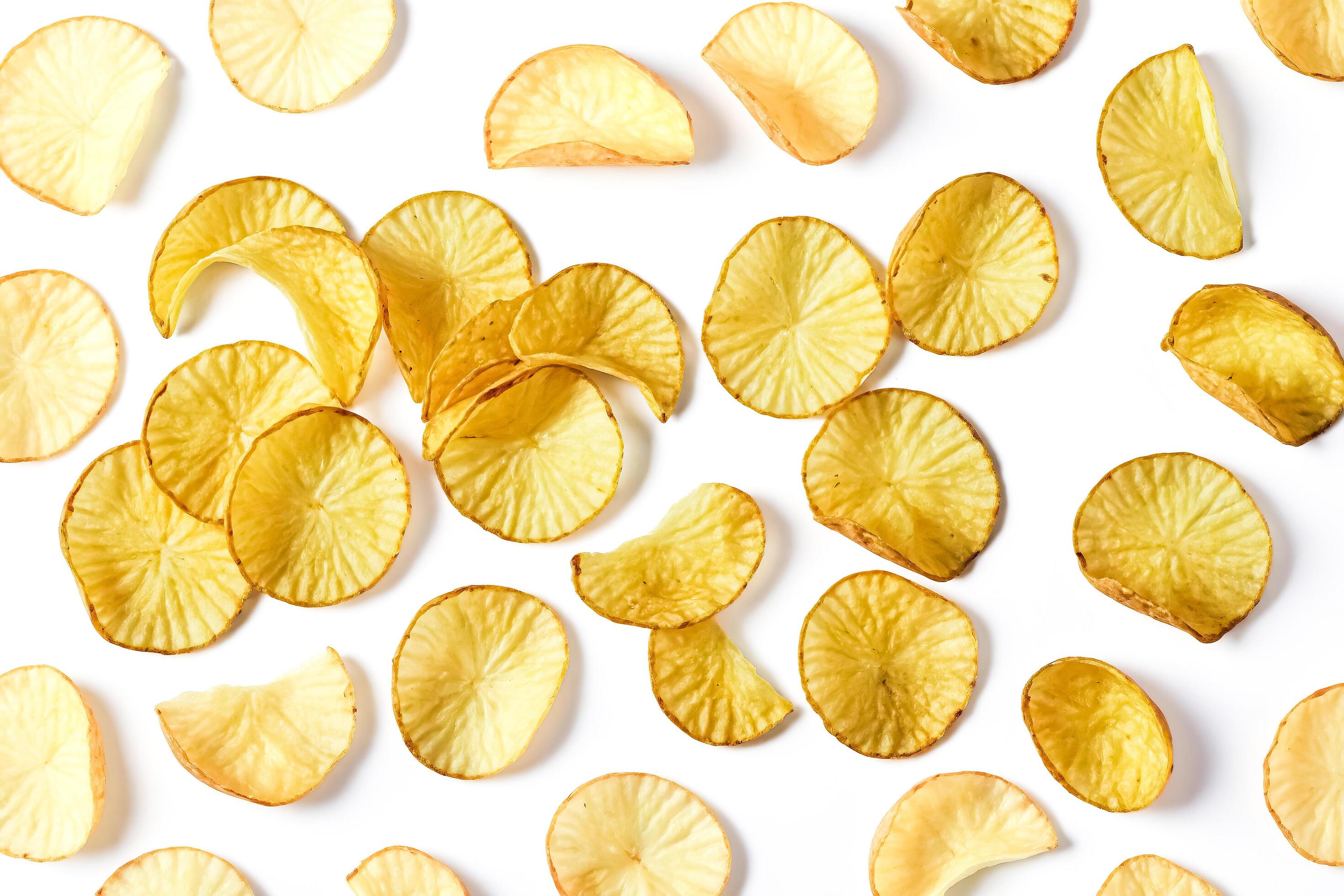 Potato Chips Scattered on White Background Stock Free