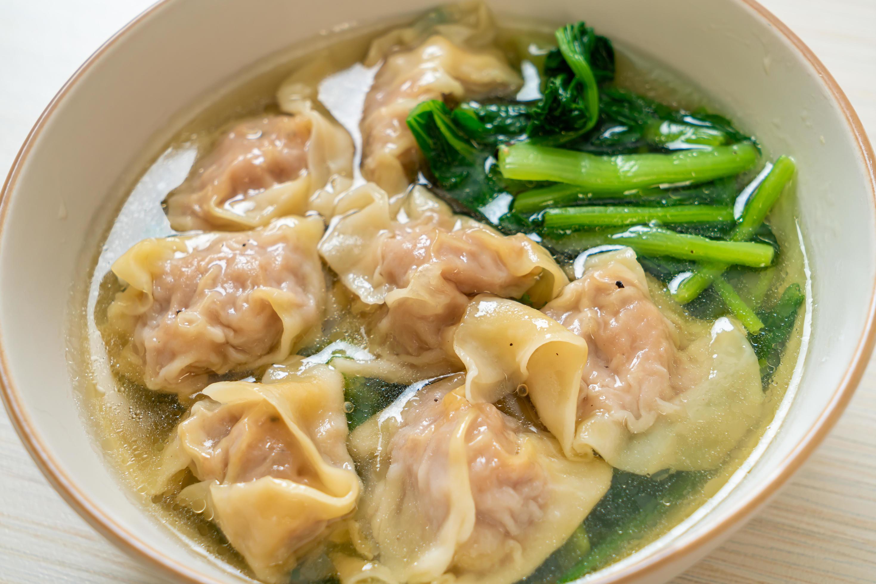 Pork wonton soup or pork dumplings soup with vegetable – Asian food style Stock Free