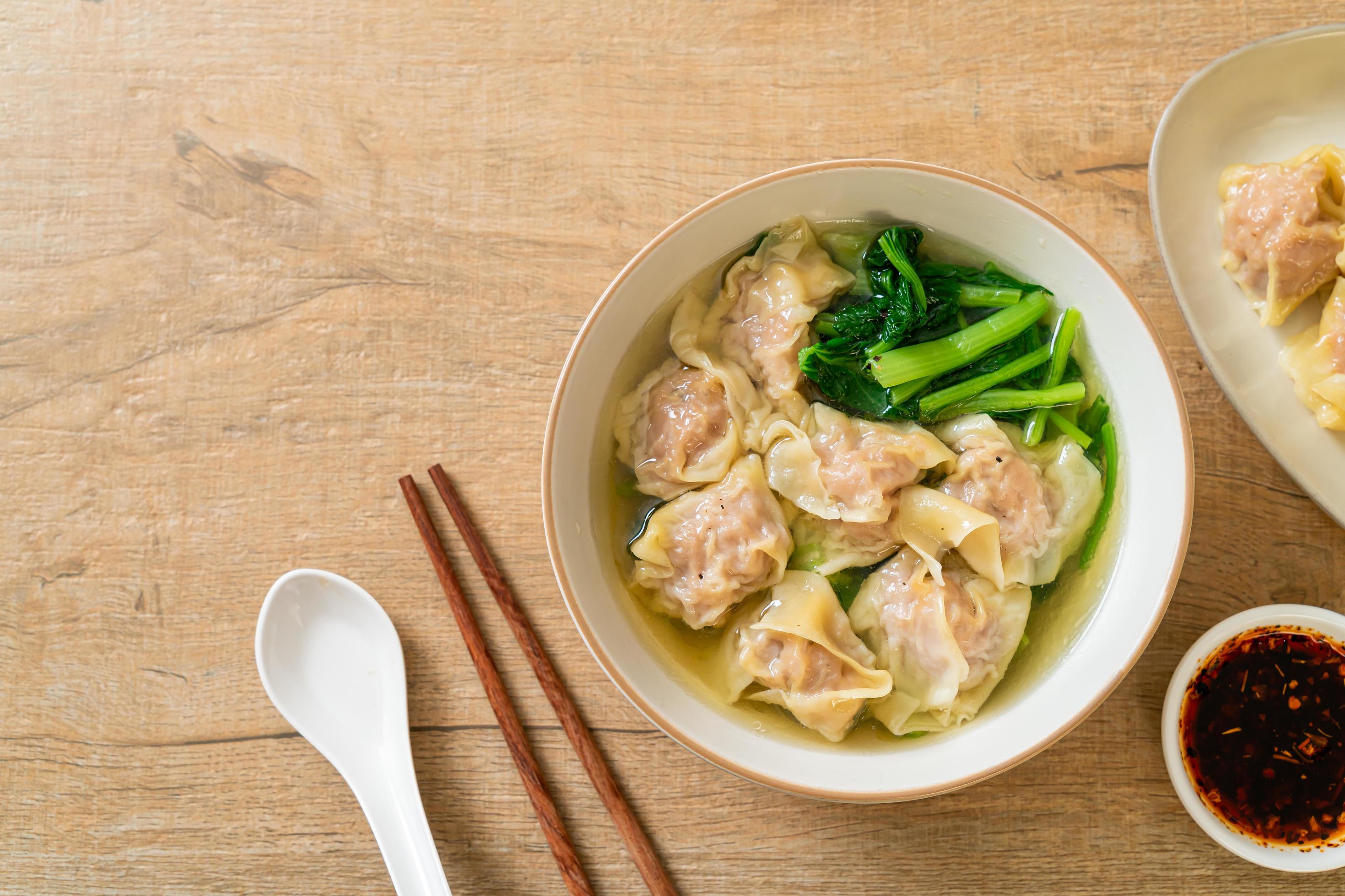 Pork wonton soup or pork dumplings soup with vegetable – Asian food style Stock Free