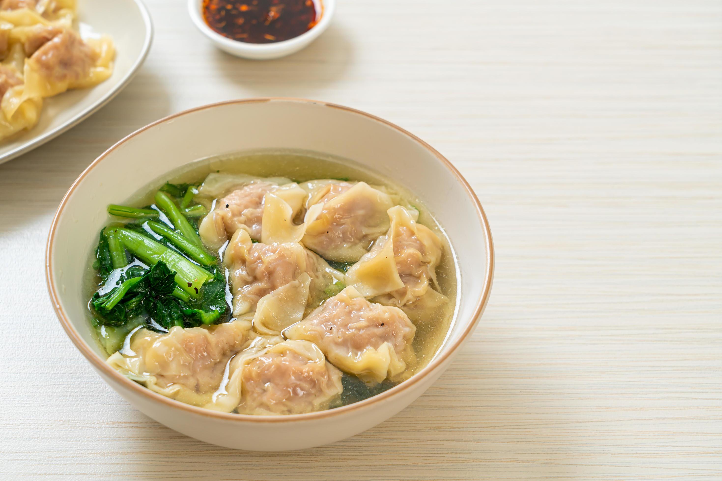 Pork wonton soup or pork dumplings soup with vegetable – Asian food style Stock Free