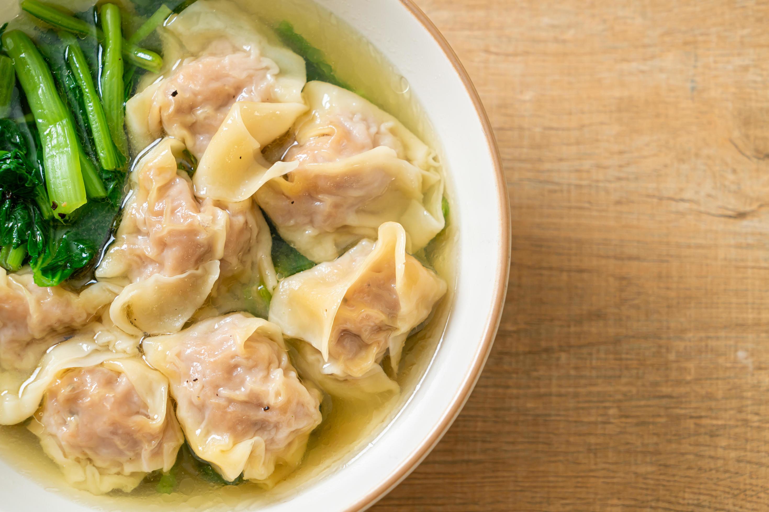 Pork wonton soup or pork dumplings soup with vegetable – Asian food style Stock Free