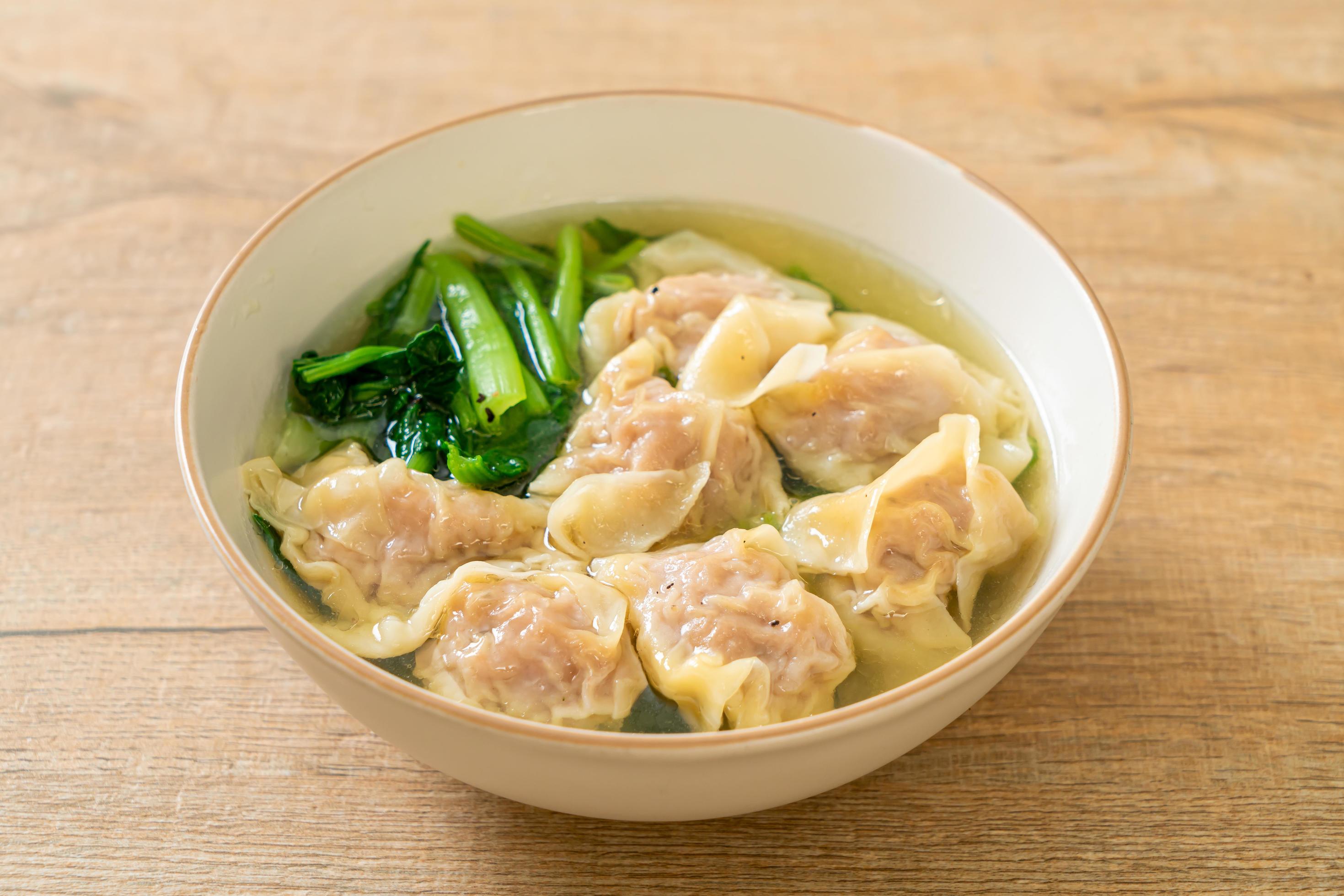 Pork wonton soup or pork dumplings soup with vegetable – Asian food style Stock Free