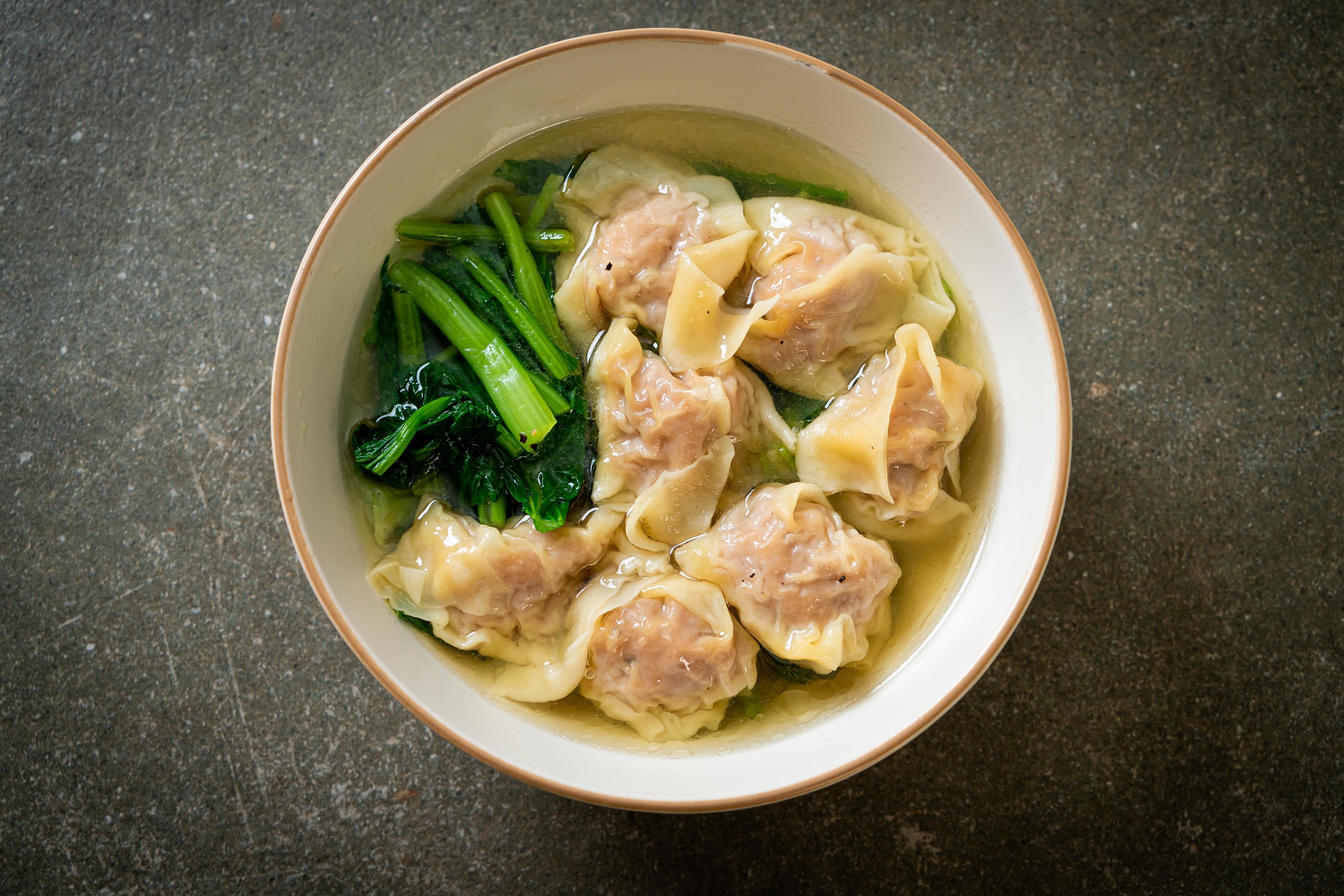 Pork wonton soup or pork dumplings soup with vegetable – Asian food style Stock Free