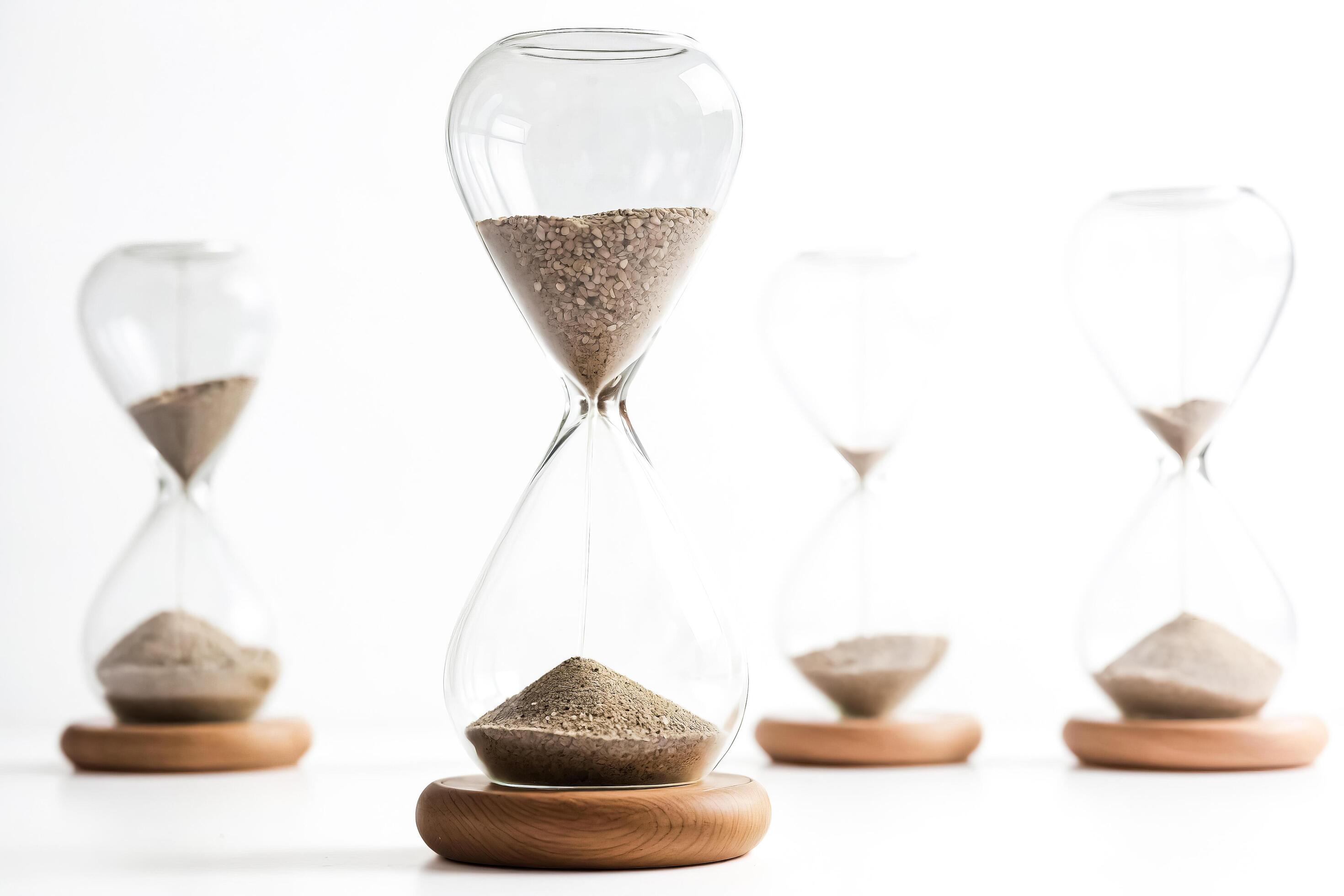 Hourglass with Sand Running Out on White Background Stock Free