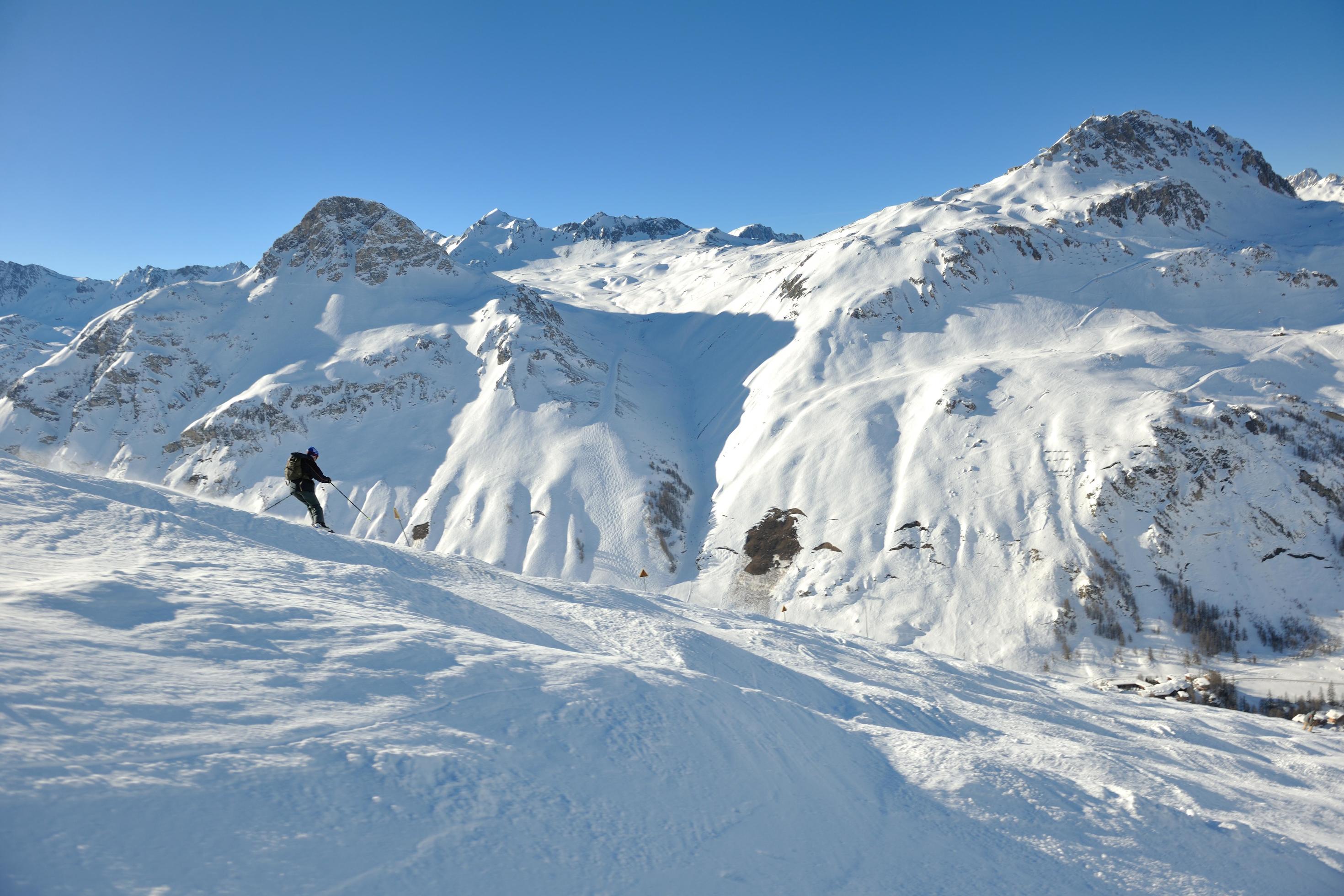 skiing on fresh snow at winter season at beautiful sunny day Stock Free