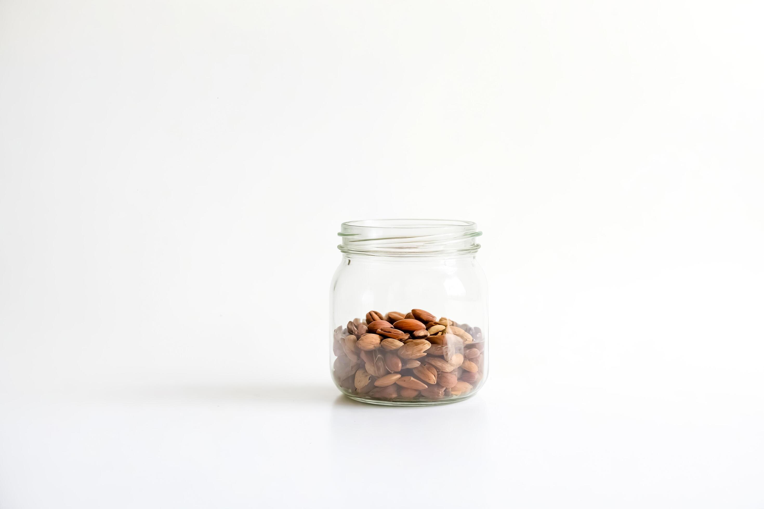 
									Jar of Nuts on White Background Stock Free