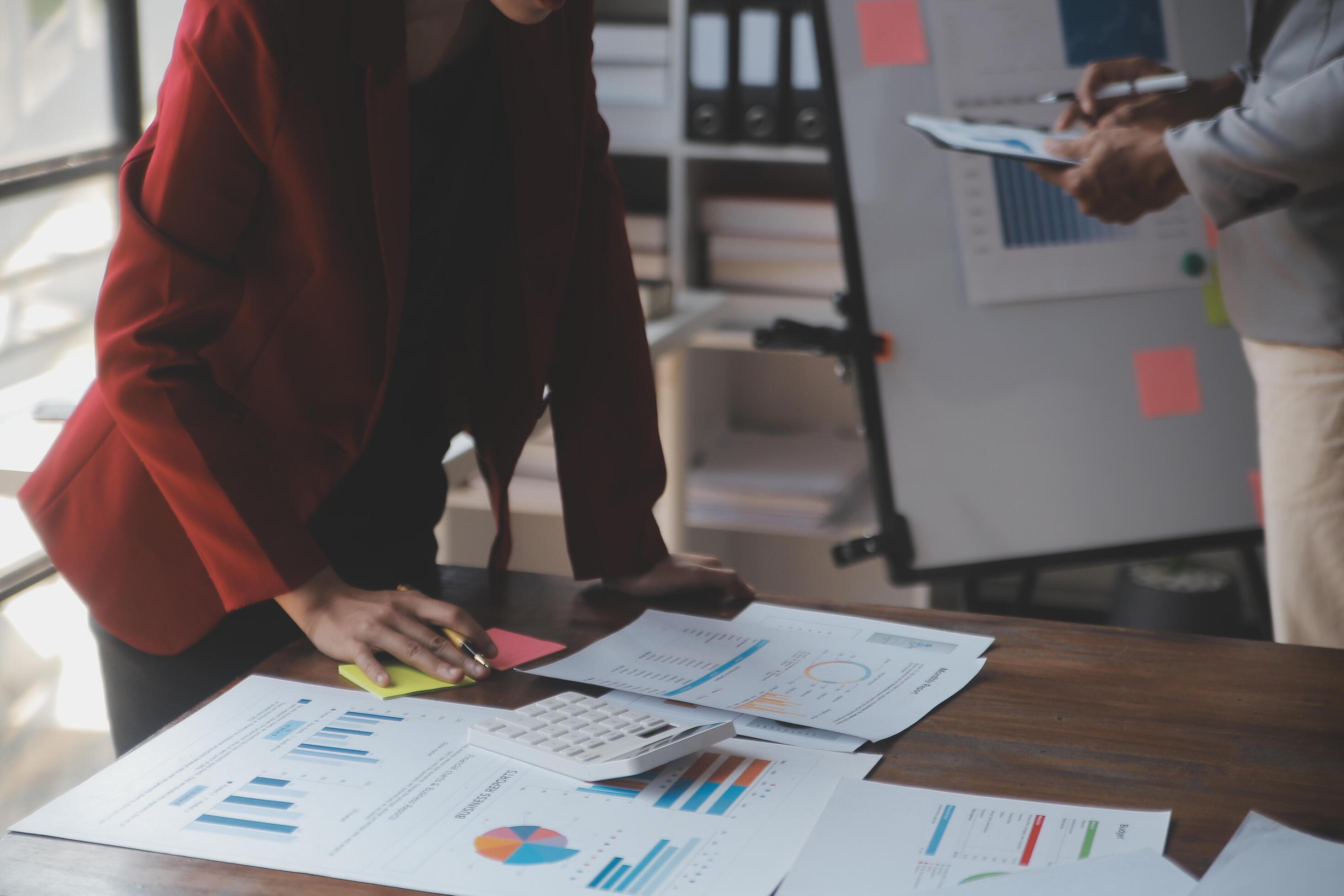 Close up of Business team analyzing income charts and graphs with modern laptop computer. Business analysis and strategy concept. Stock Free