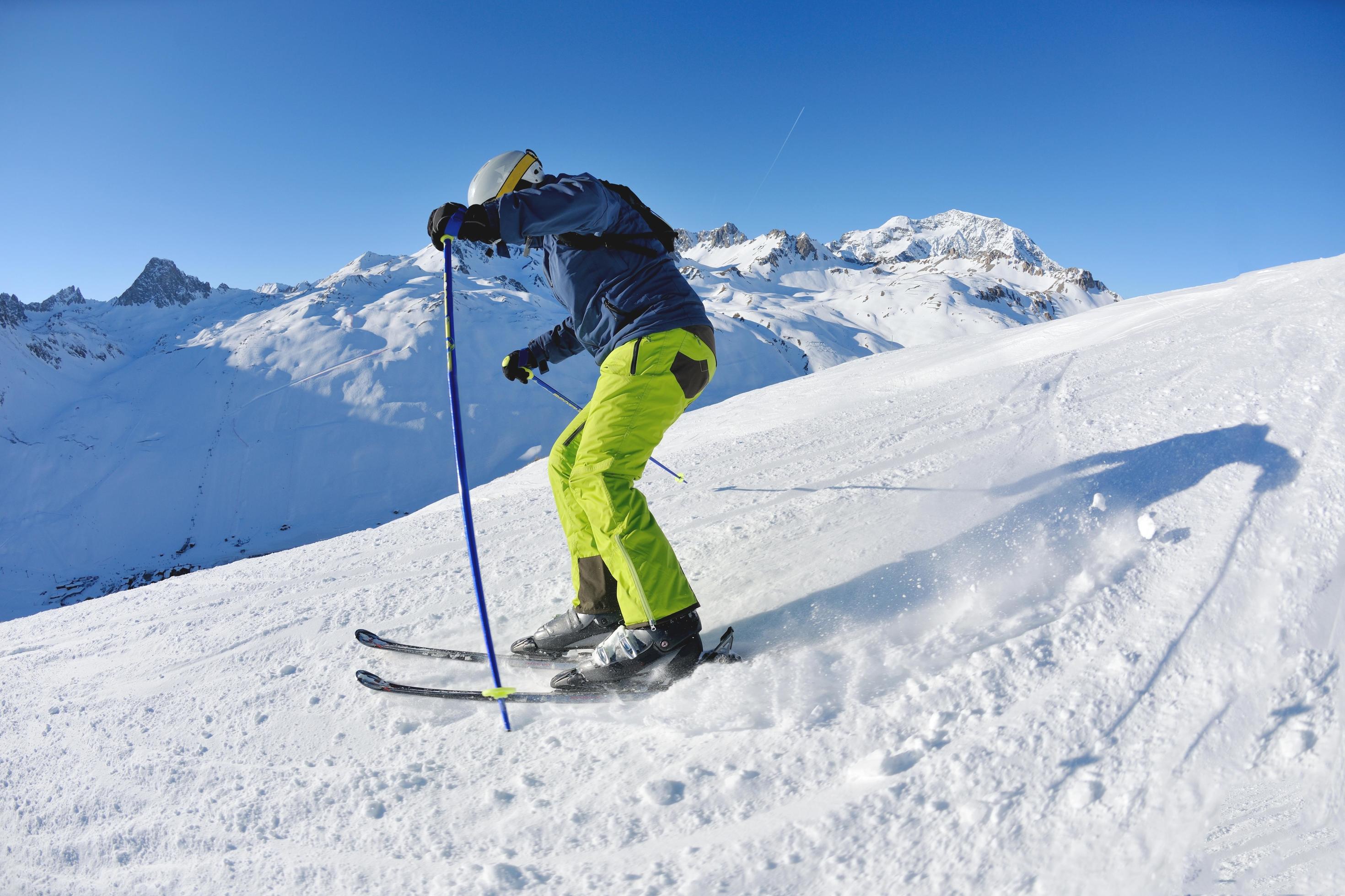 skiing on fresh snow at winter season at beautiful sunny day Stock Free