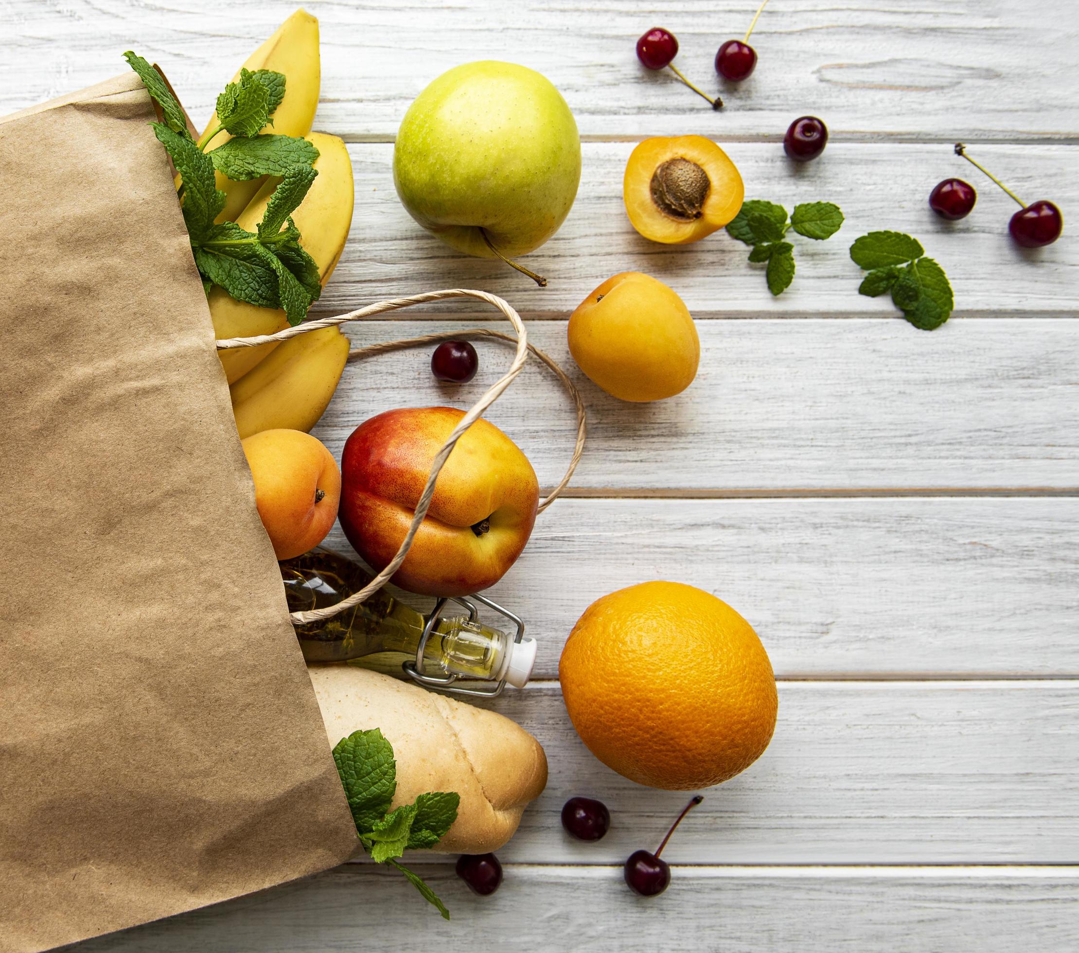 Healthy food in paper bag, fruits and berries Stock Free