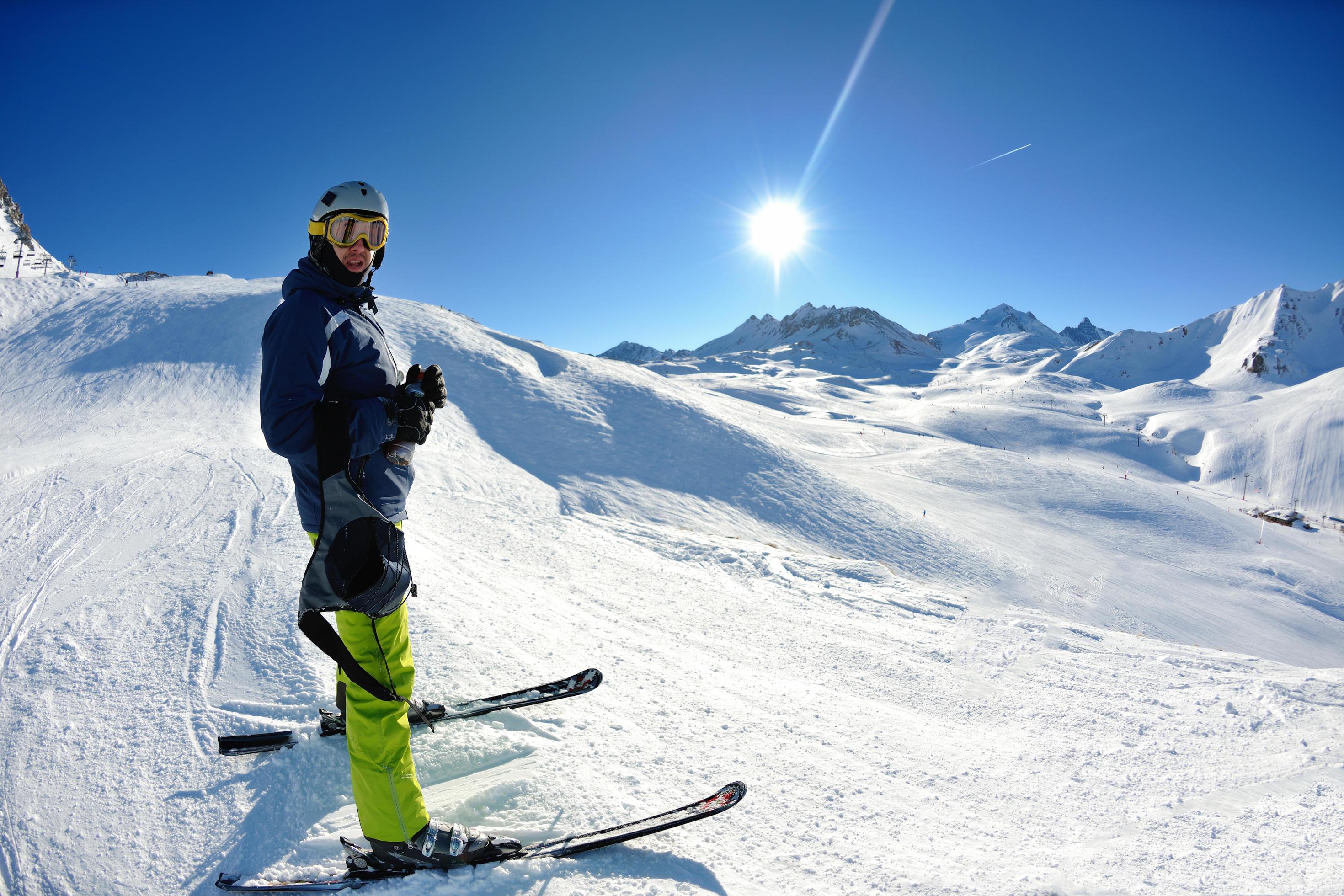 skiing on fresh snow at winter season at beautiful sunny day Stock Free