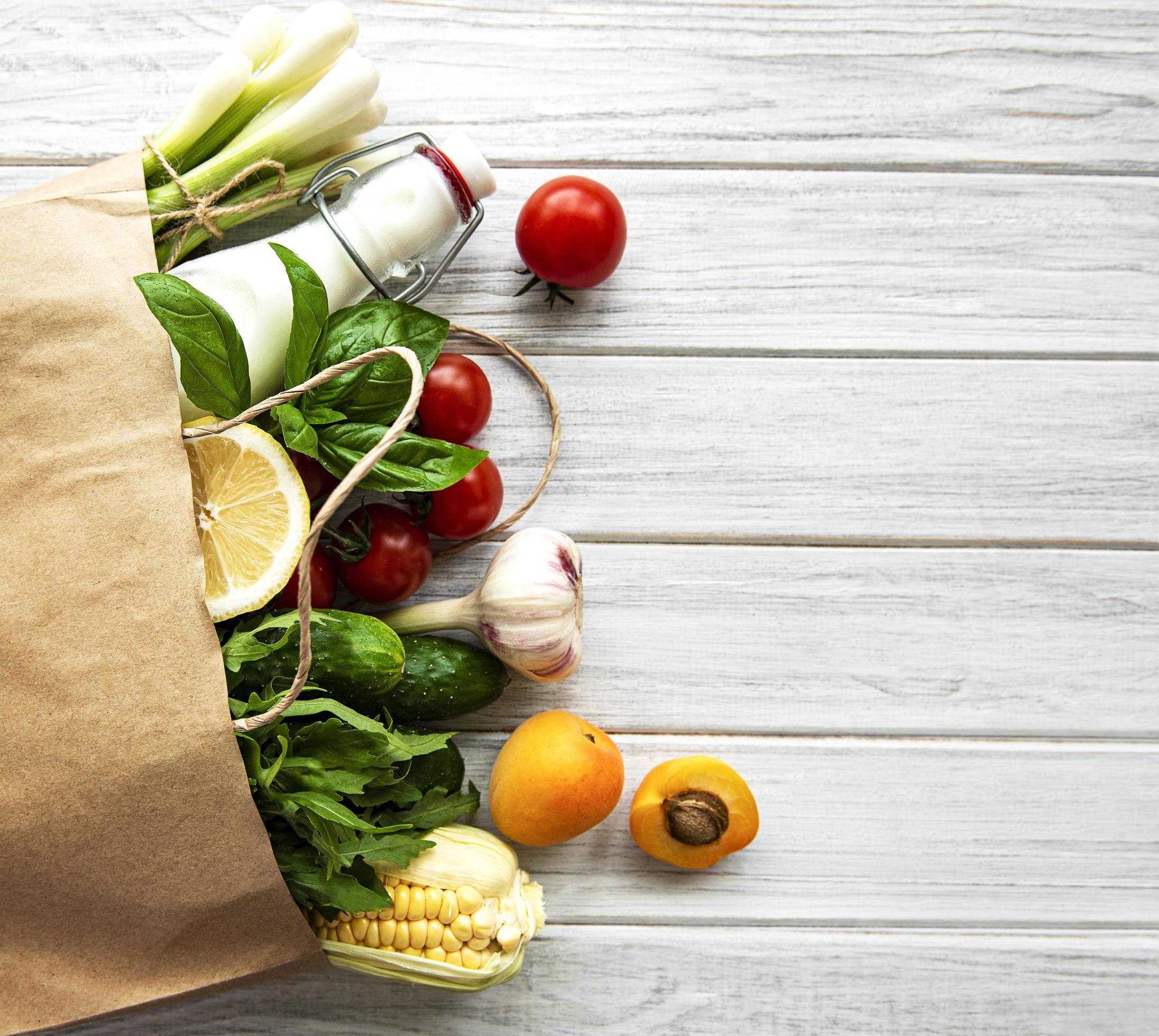 Healthy food in paper bag, vegetables and fruits Stock Free