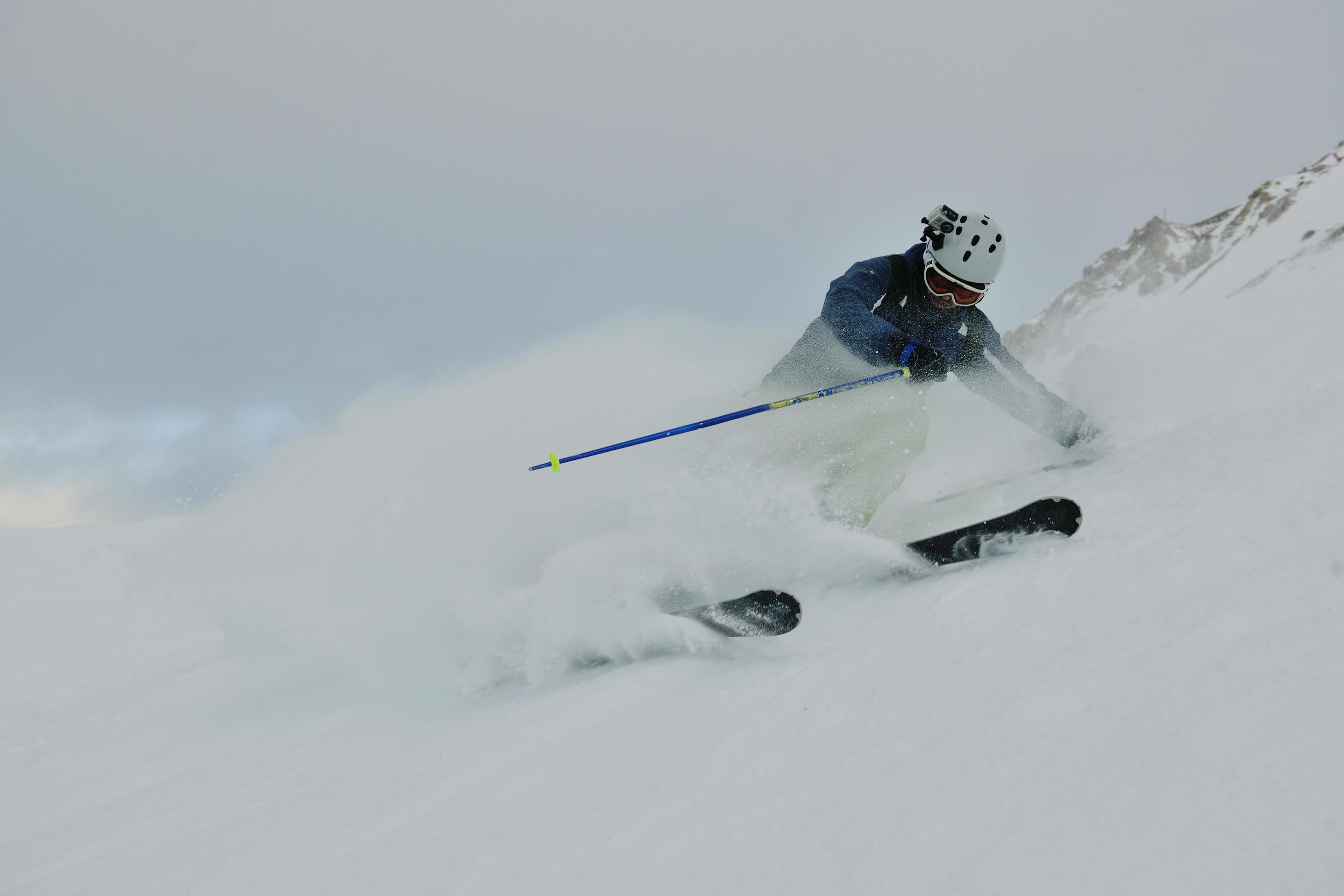 skiing on fresh snow at winter season at beautiful sunny day Stock Free