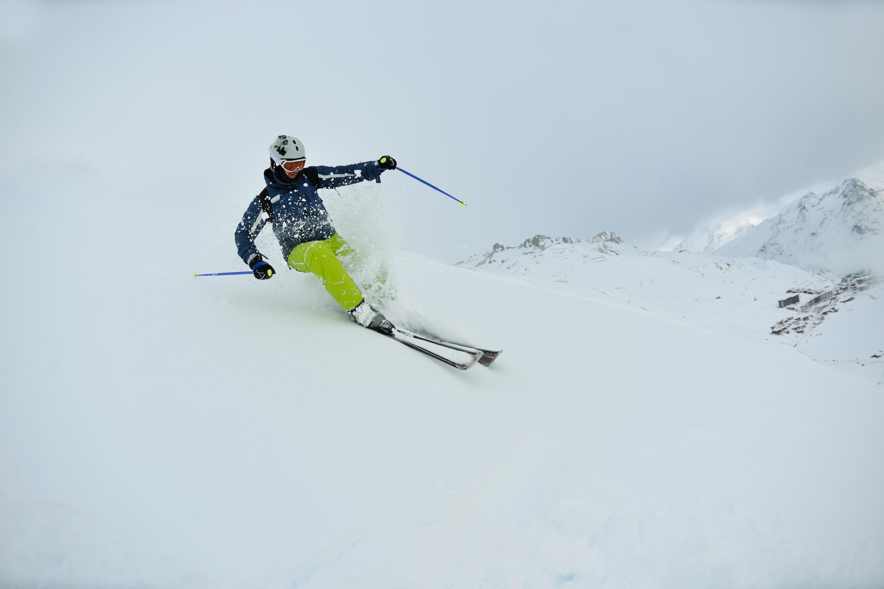 skiing on fresh snow at winter season at beautiful sunny day Stock Free