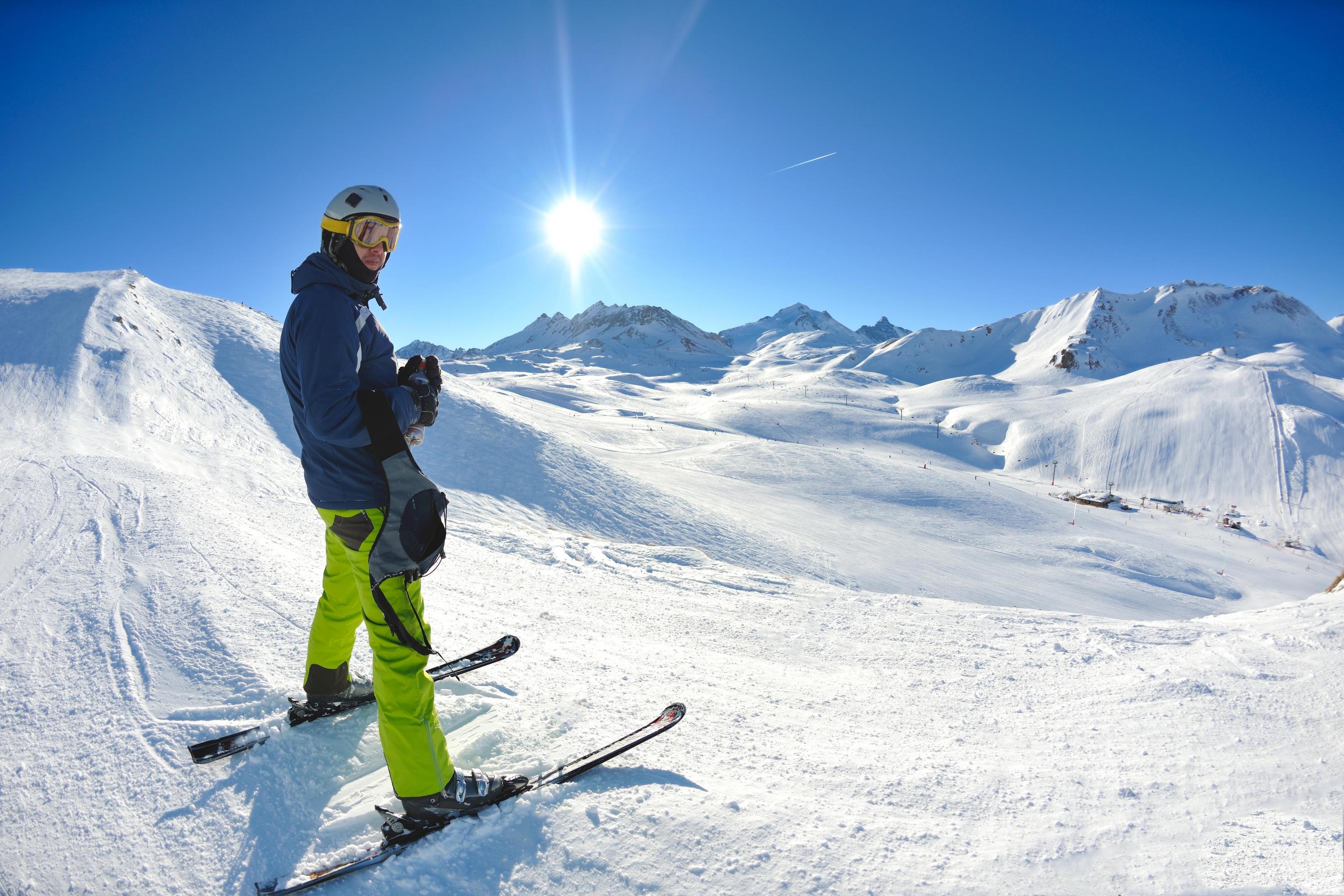 skiing on fresh snow at winter season at beautiful sunny day Stock Free