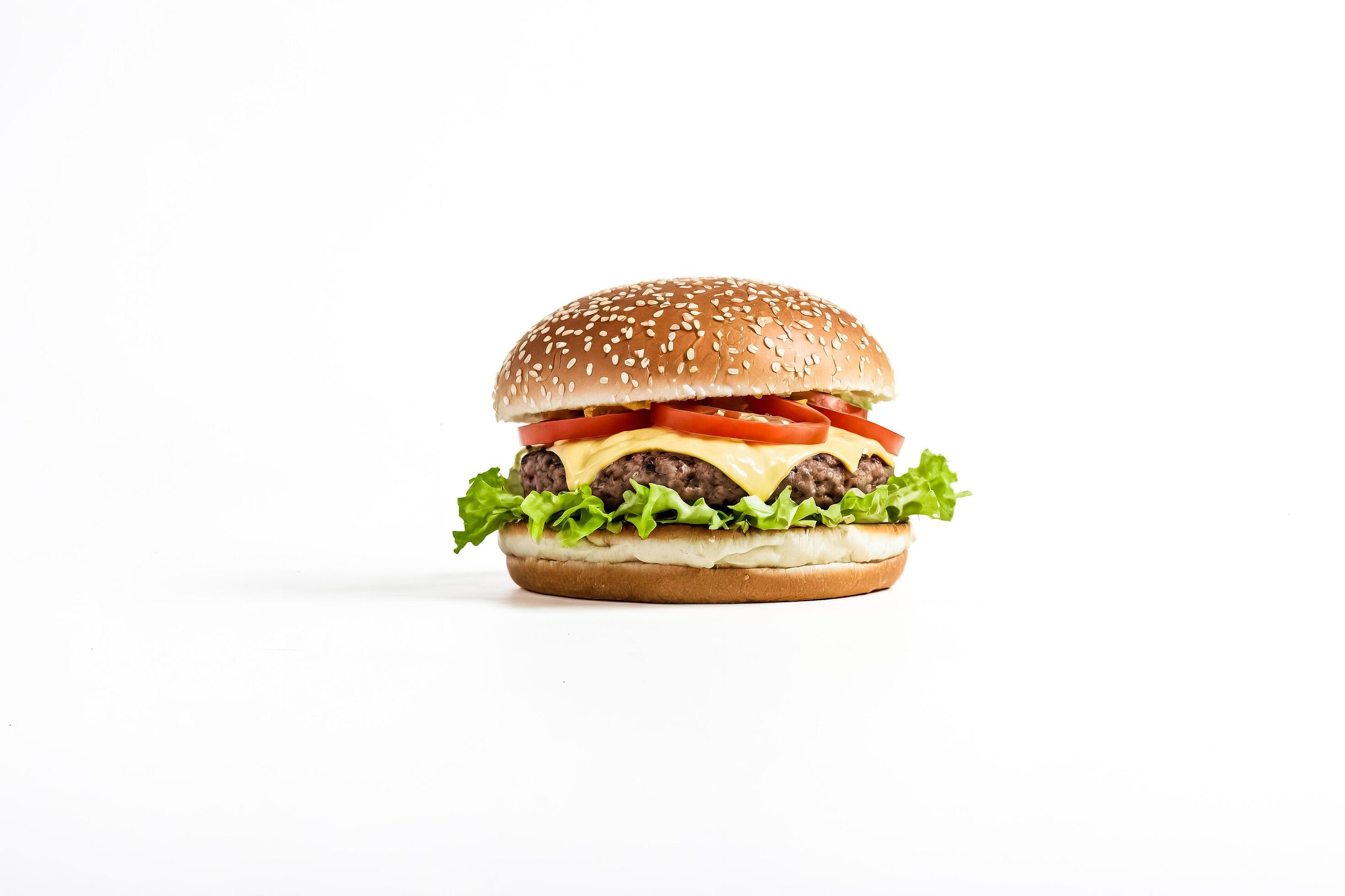 Close-up of a Delicious Cheeseburger with Lettuce and Tomato on a White Background Stock Free