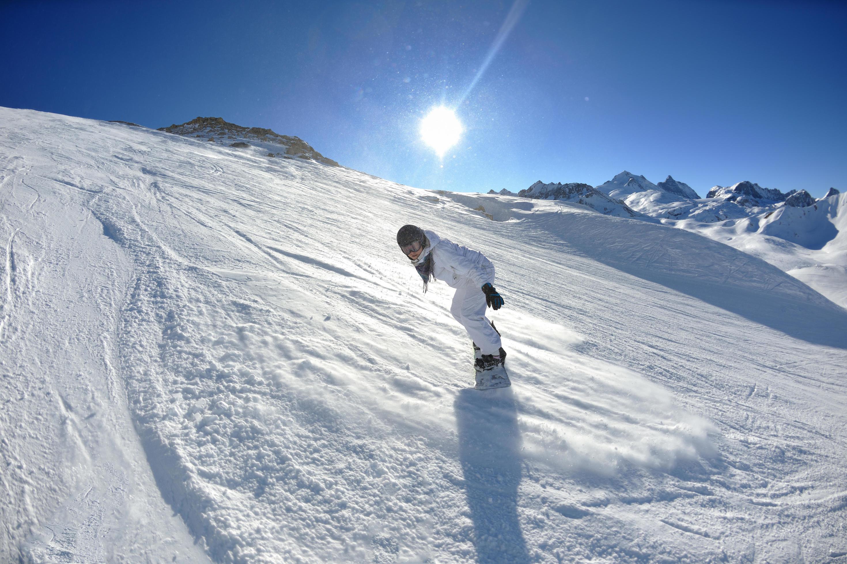 skiing on fresh snow at winter season at beautiful sunny day Stock Free