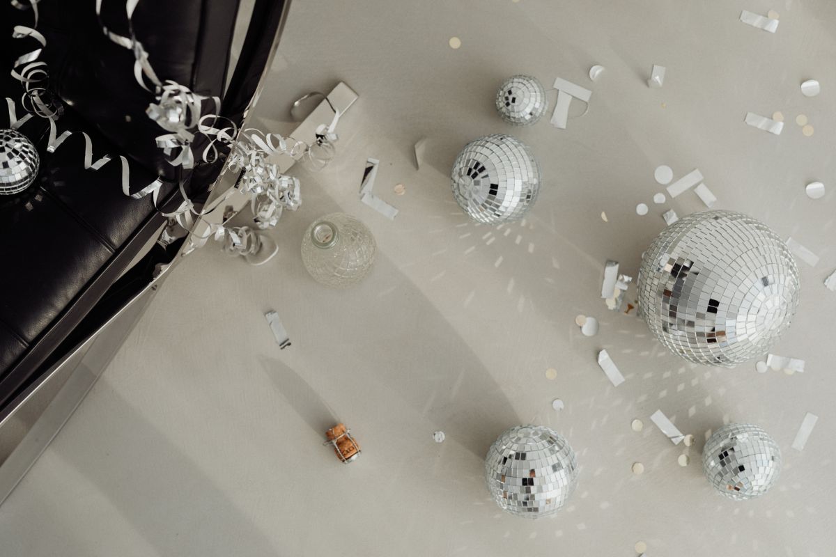 New Year’s Eve party mess – confetti – disco balls Stock Free